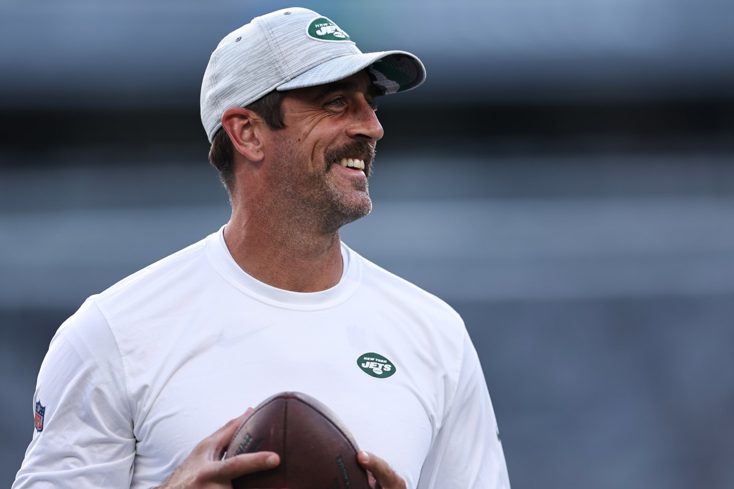 EAST RUTHERFORD, NEW JERSEY - AUGUST 19: Aaron Rodgers #8 of the New York Jets warms up before the preseason game against the Tampa Bay Buccaneers at MetLife Stadium on August 19, 2023 in East Rutherford, New Jersey. (Photo by Dustin Satloff/Getty Images)