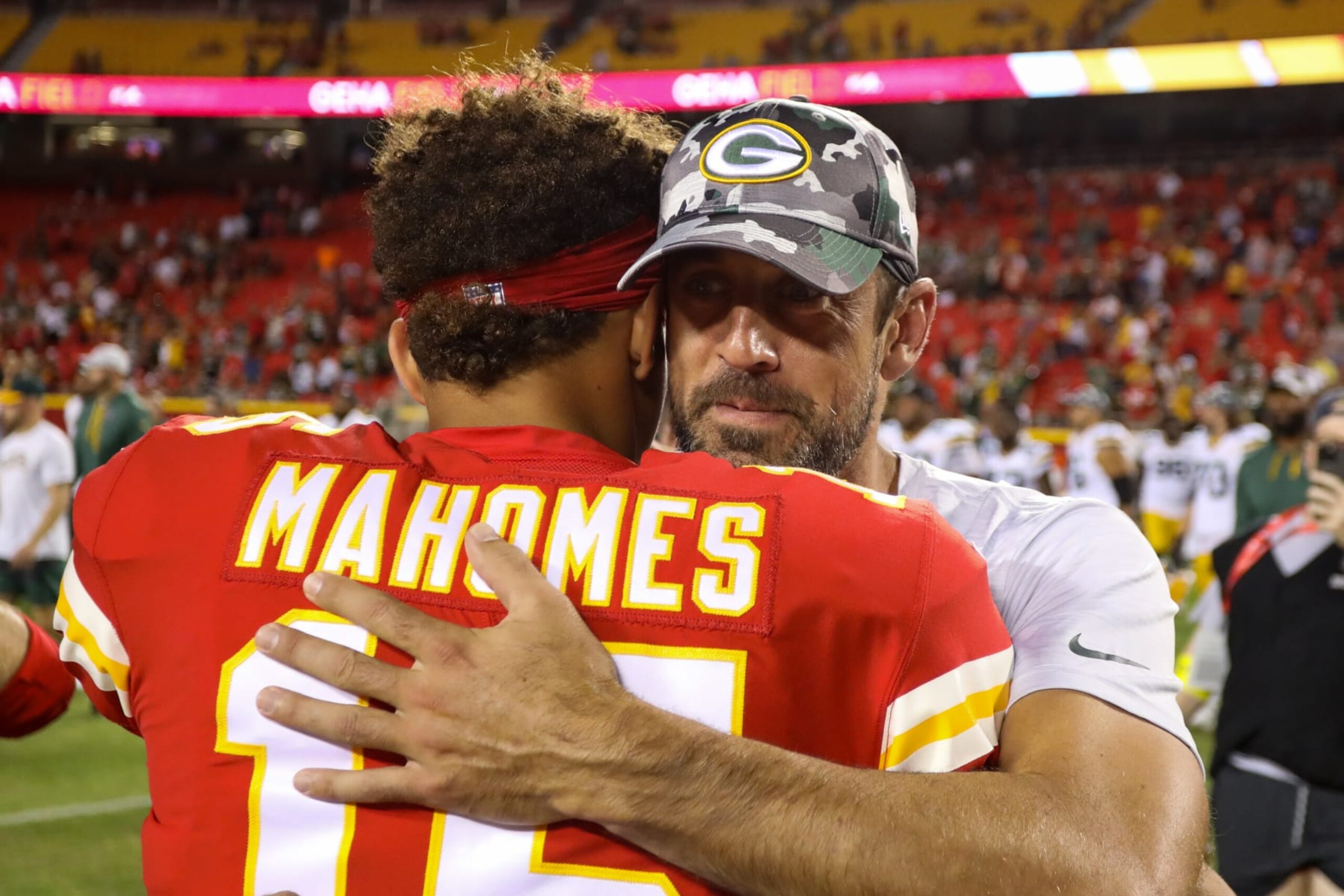 KANSAS CITY, MO - AUGUST 25: Kansas City Chiefs quarterback Patrick Mahomes (15) and Green Bay Packers quarterback Aaron Rodgers (12) hug on the field after an NFL preseason game between the Green Bay Packers and Kansas City Chiefs on August 25, 2022 at GEHA Field at Arrowhead Stadium in Kansas City, MO. (Photo by Scott Winters/Icon Sportswire via Getty Images)