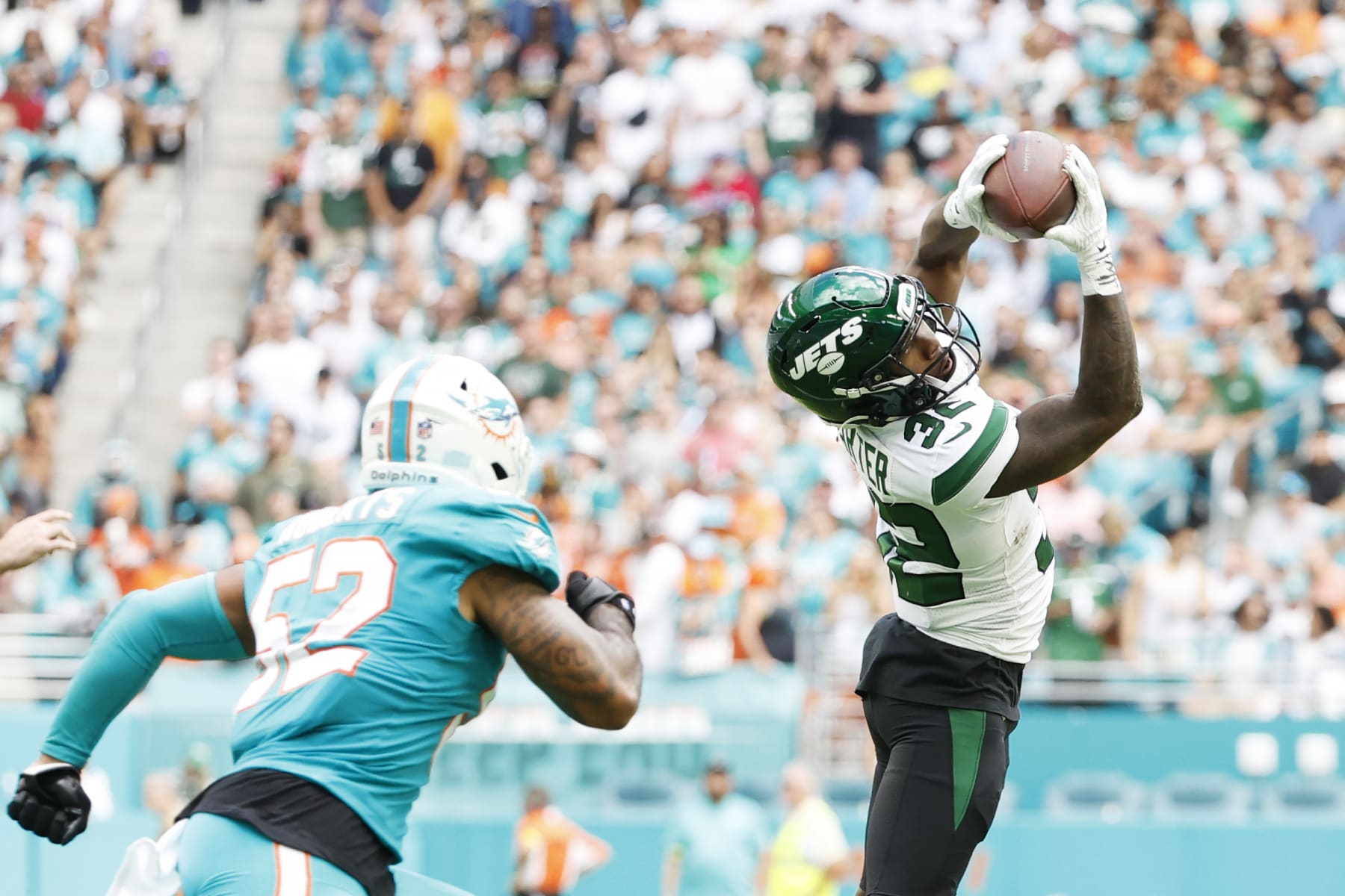MIAMI GARDENS, FLORIDA - JANUARY 08: Running back Michael Carter #32 of the New York Jets during their game against the Miami Dolphins at Hard Rock Stadium on January 08, 2023 in Miami Gardens, Florida. (Photo by Cliff Hawkins/Getty Images)