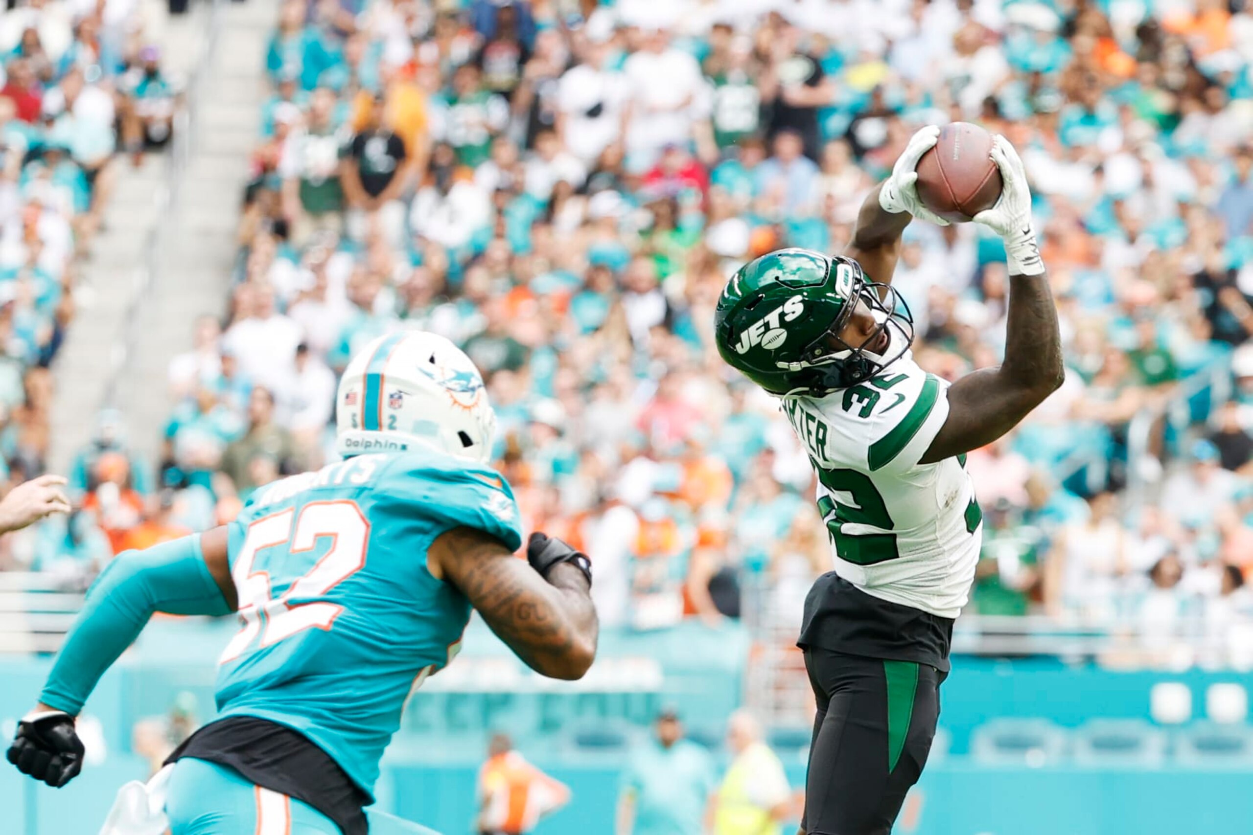 MIAMI GARDENS, FLORIDA - JANUARY 08: Running back Michael Carter #32 of the New York Jets during their game against the Miami Dolphins at Hard Rock Stadium on January 08, 2023 in Miami Gardens, Florida. (Photo by Cliff Hawkins/Getty Images)