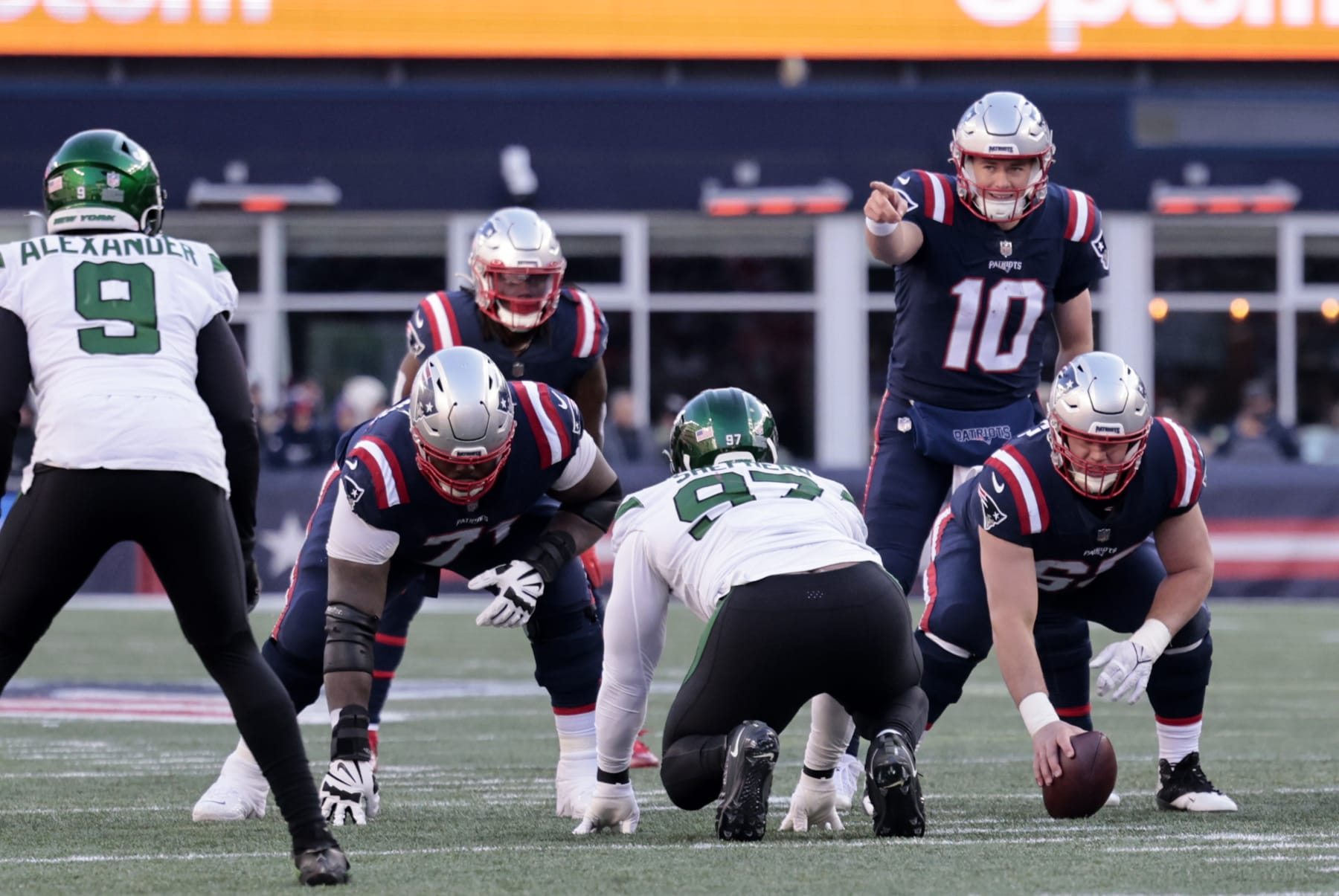 FOXBOROUGH, MA - NOVEMBER 20: New England Patriots quarterback Mac Jones (10) points out New York Jets linebacker Kwon Alexander (9) during a game between the New England Patriots and the New York Jets on November 20, 2022, at Gillette Stadium in Foxborough, Massachusetts. (Photo by Fred Kfoury III/Icon Sportswire via Getty Images)