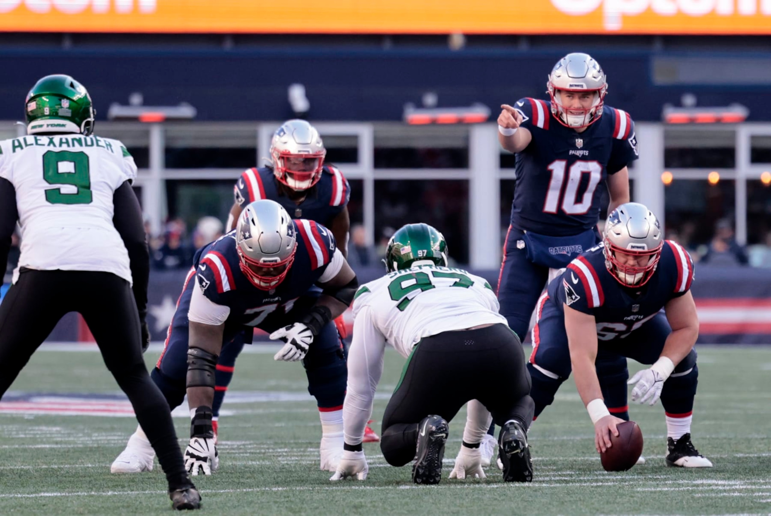 FOXBOROUGH, MA - NOVEMBER 20: New England Patriots quarterback Mac Jones (10) points out New York Jets linebacker Kwon Alexander (9) during a game between the New England Patriots and the New York Jets on November 20, 2022, at Gillette Stadium in Foxborough, Massachusetts. (Photo by Fred Kfoury III/Icon Sportswire via Getty Images)