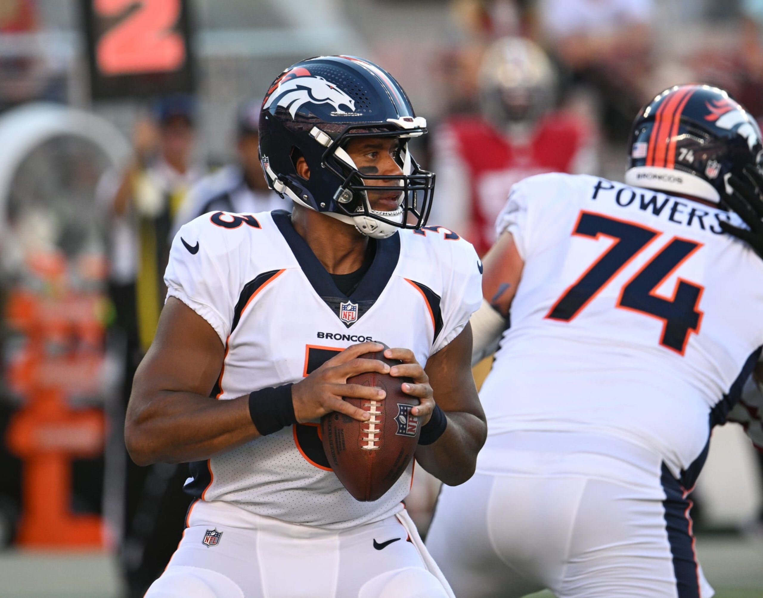 SANTA CLARA, CALIFORNIA - AUGUST 19: Russell Wilson #3 of the Denver Broncos looks to pass during the first half of a preseason game against the San Francisco 49ers at Levi's Stadium on August 19, 2023 in Santa Clara, California. (Photo by Loren Elliott/Getty Images)