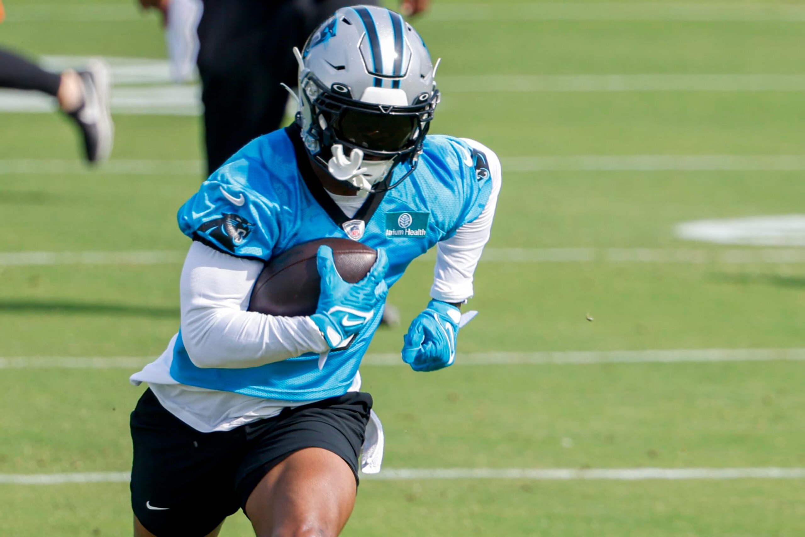 FILE- Carolina Panthers running back Miles Sanders runs after a catch during NFL football practices in Charlotte, N.C., Monday, May 22, 2023. Sanders joined the Panthers as a free agent this offseason, signing a four-year, $25 million contract helping Carolina offset the loss of Christian McCaffrey, who was traded away early last season as the team was in the midst of a roster makeover. (AP Photo/Nell Redmond) FILE- Carolina Panthers running back Miles Sanders runs after a catch during NFL football practices in Charlotte, N.C., Monday, May 22, 2023. Sanders joined the Panthers as a free agent this offseason, signing a four-year, $25 million contract helping Carolina offset the loss of Christian McCaffrey, who was traded away early last season as the team was in the midst of a roster makeover. (AP Photo/Nell Redmond)