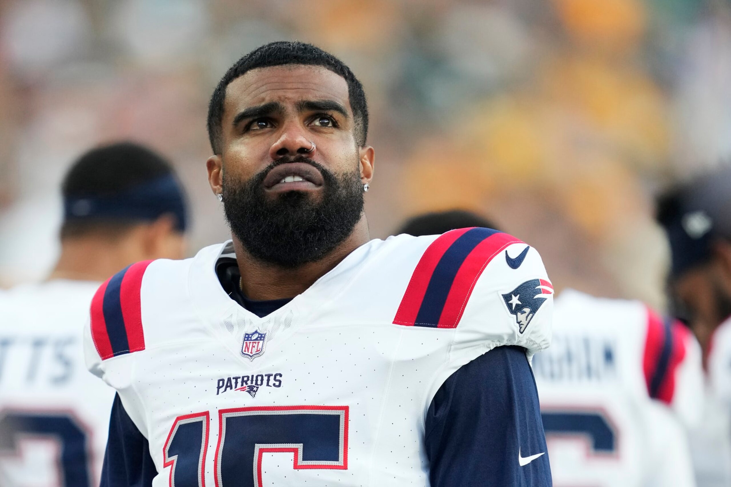 GREEN BAY, WISCONSIN - AUGUST 19: Ezekiel Elliott #15 of the New England Patriots looks on before the start of a preseason game against the Green Bay Packers at Lambeau Field on August 19, 2023 in Green Bay, Wisconsin. (Photo by Patrick McDermott/Getty Images)