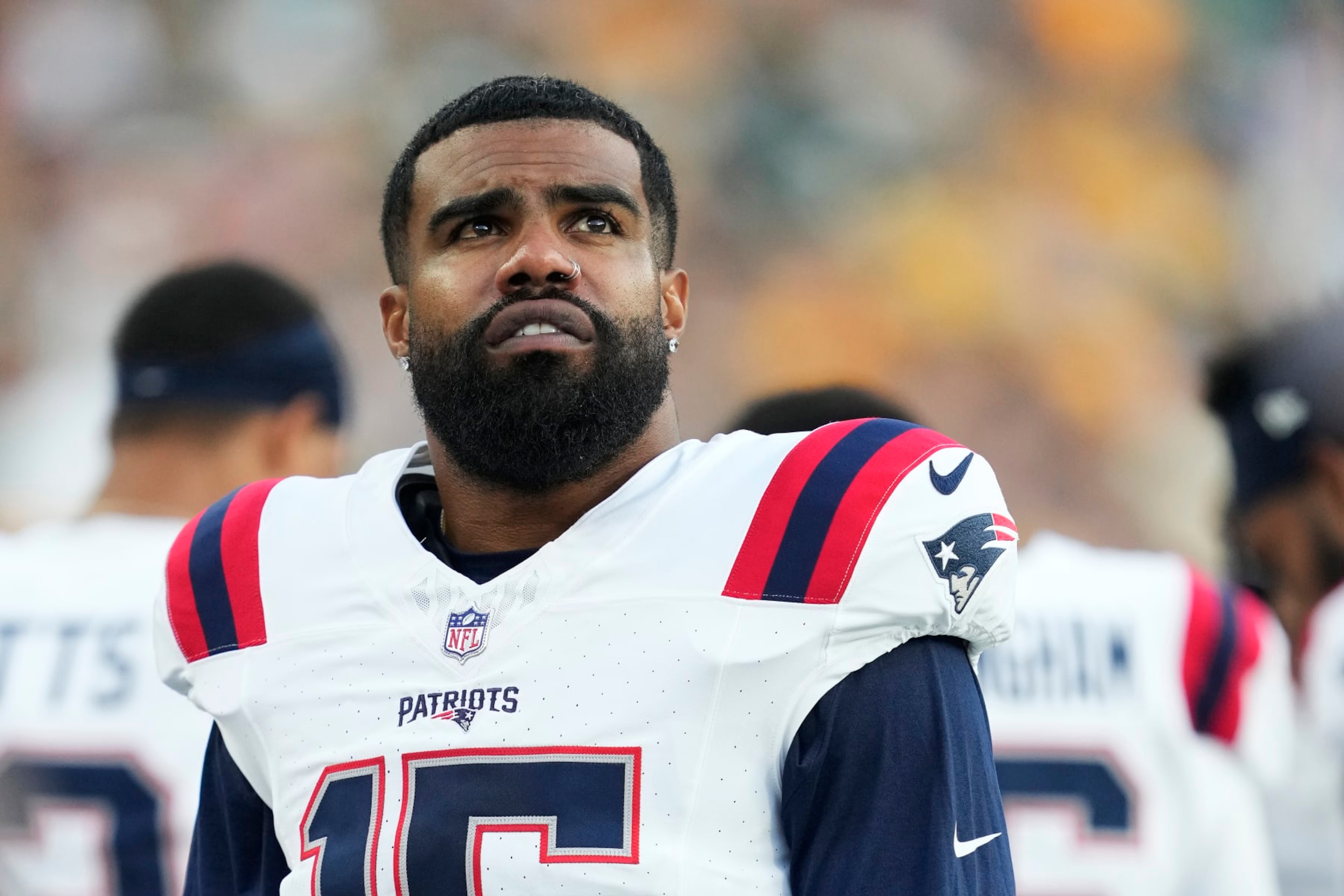 GREEN BAY, WISCONSIN - AUGUST 19: Ezekiel Elliott #15 of the New England Patriots looks on before the start of a preseason game against the Green Bay Packers at Lambeau Field on August 19, 2023 in Green Bay, Wisconsin. (Photo by Patrick McDermott/Getty Images) GREEN BAY, WISCONSIN - AUGUST 19: Ezekiel Elliott #15 of the New England Patriots looks on before the start of a preseason game against the Green Bay Packers at Lambeau Field on August 19, 2023 in Green Bay, Wisconsin. (Photo by Patrick McDermott/Getty Images)