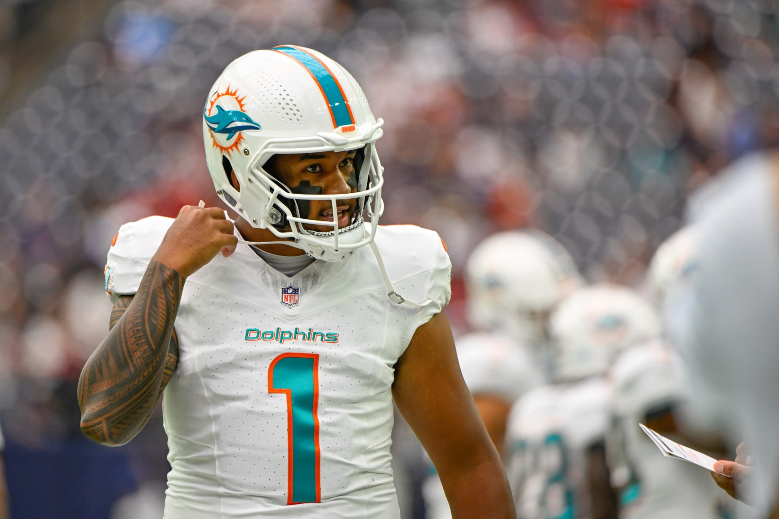 HOUSTON, TX - AUGUST 19: Miami Dolphins quarterback Tua Tagovailoa (1) prepars for the first offensive series during the football game between the Miami Dolphins and Houston Texans at NRG Stadium on August, 19, 2023 in Houston, Texas. (Photo by Ken Murray/Icon Sportswire via Getty Images)
