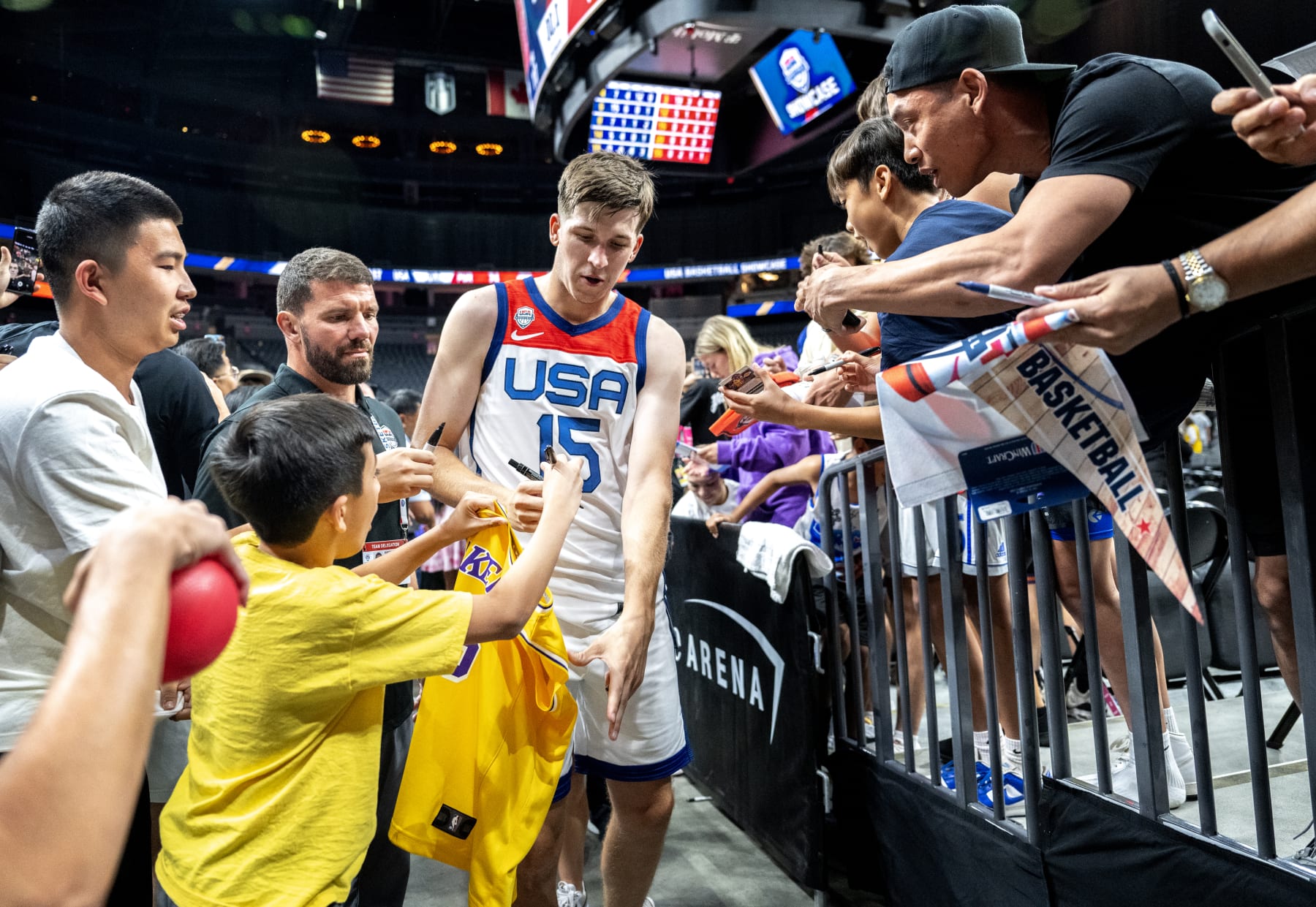LAS VEGAS, NV - AUGUST 7, 2023:  Austin Reaves signs a fans Lakers jersey  while leaving the court after the 2023 USA Men's National Team beat Puerto Rico at T-Mobile Arena on August 7, 2023 in Las Vegas, Nevada. (Gina Ferazzi / Los Angeles Times via Getty Images)