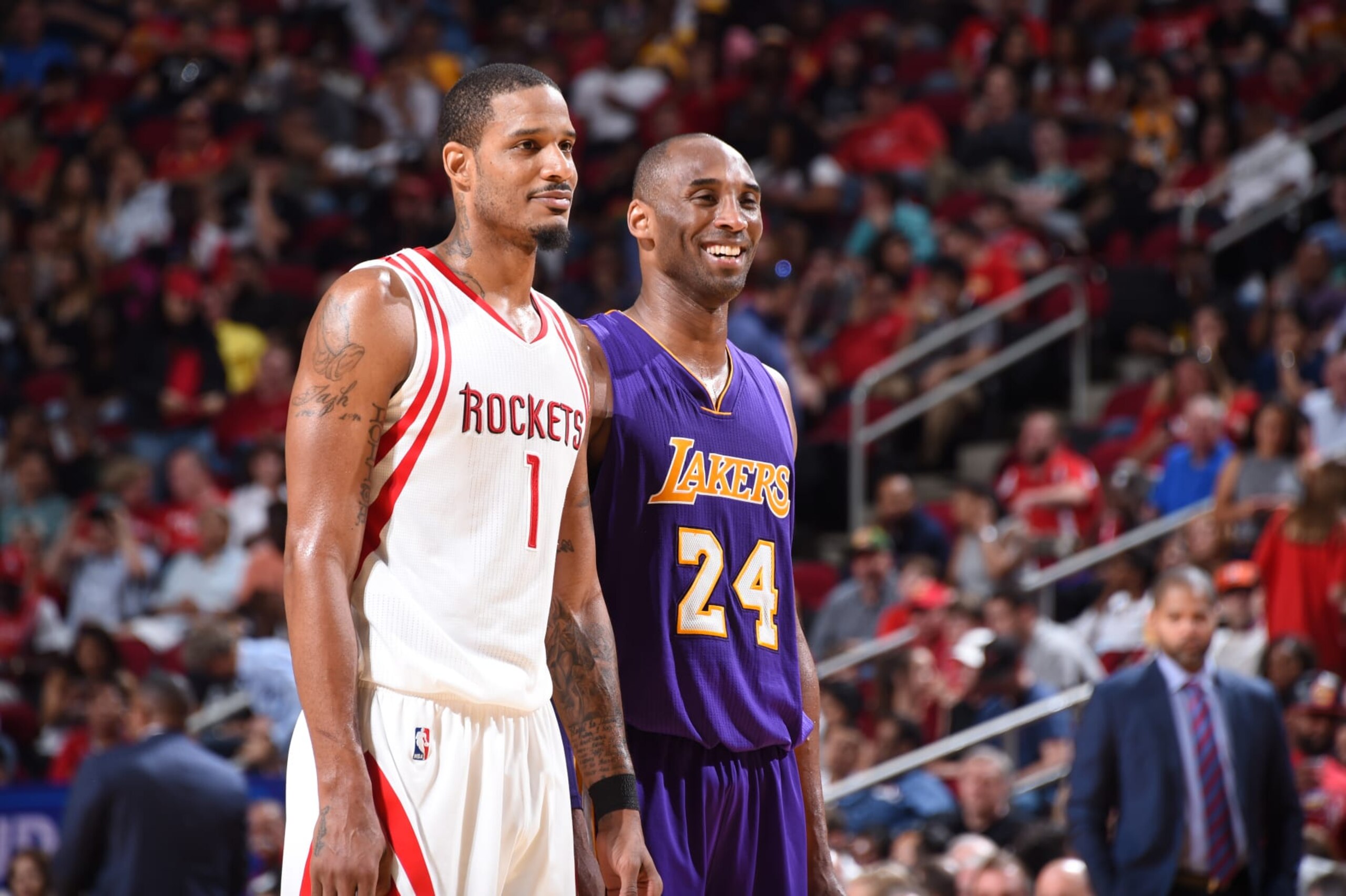 HOUSTON, TX - APRIL 10:  Kobe Bryant #24 of the Los Angeles Lakers talks with Trevor Ariza #1 of the Houston Rockets during the game on April 10, 2016 at the Toyota Center in Houston, Texas. NOTE TO USER: User expressly acknowledges and agrees that, by downloading and or using this photograph, User is consenting to the terms and conditions of the Getty Images License Agreement. Mandatory Copyright Notice: Copyright 2016 NBAE (Photo by Andrew D. Bernstein/NBAE via Getty Images)