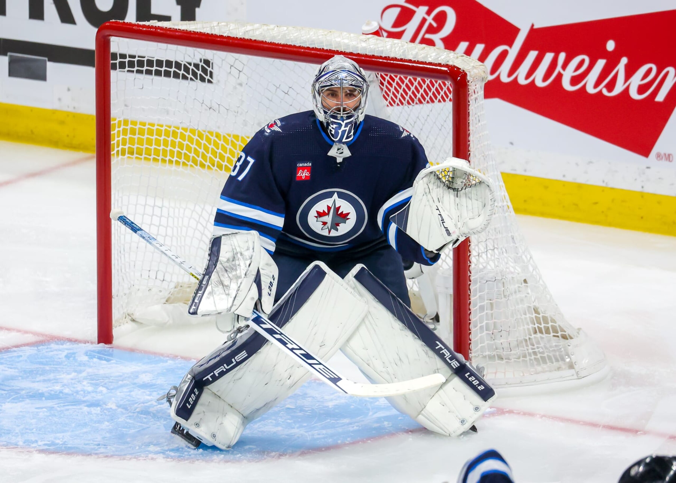 WINNIPEG, CANADA - APRIL 22: Goaltender Connor Hellebuyck #37 of the Winnipeg Jets guards the net during first period action against the Vegas Golden Knights in Game Three of the First Round of the 2023 Stanley Cup Playoffs at Canada Life Centre on April 22, 2023 in Winnipeg, Manitoba, Canada. (Photo by Jonathan Kozub/NHLI via Getty Images) WINNIPEG, CANADA - APRIL 22: Goaltender Connor Hellebuyck #37 of the Winnipeg Jets guards the net during first period action against the Vegas Golden Knights in Game Three of the First Round of the 2023 Stanley Cup Playoffs at Canada Life Centre on April 22, 2023 in Winnipeg, Manitoba, Canada. (Photo by Jonathan Kozub/NHLI via Getty Images)