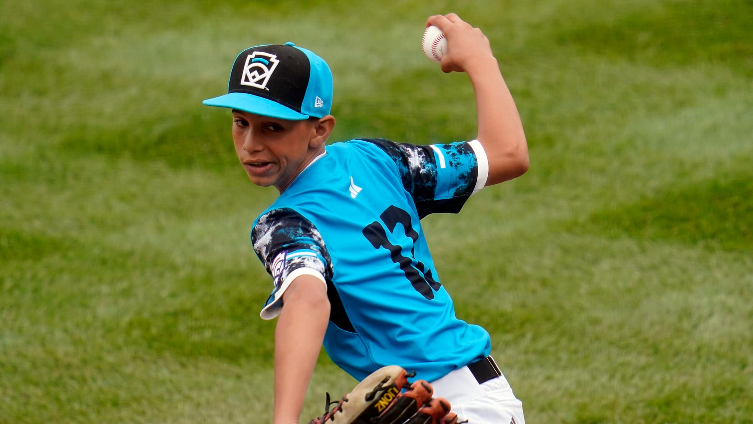 Taiwan starting pitcher Cai Yuan-Hao (8) delivers a pitch against Curacao during the first inning of a baseball game at the Little League World Series tournament in South Williamsport, Pa., Wednesday, Aug. 23, 2023. (AP Photo/Tom E. Puskar)