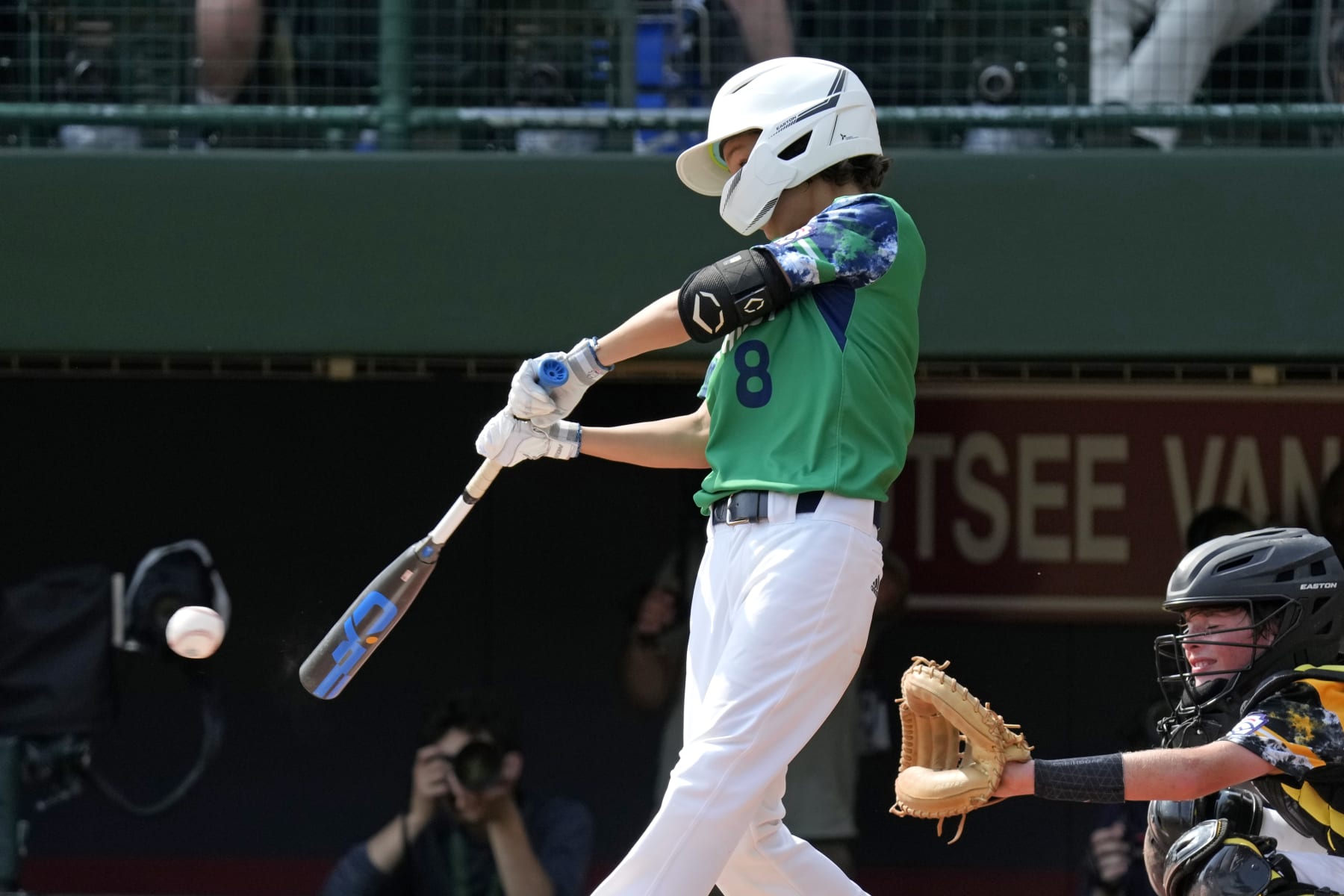 Seattle, Wash.'s Sam Santos (8) singles off Nolensville, Tenn.'s Lucas McCauley, driving in a run, during the second inning of a baseball game at the Little League World Series in South Williamsport, Pa., Monday, Aug. 21, 2021. (AP Photo/Gene J. Puskar)