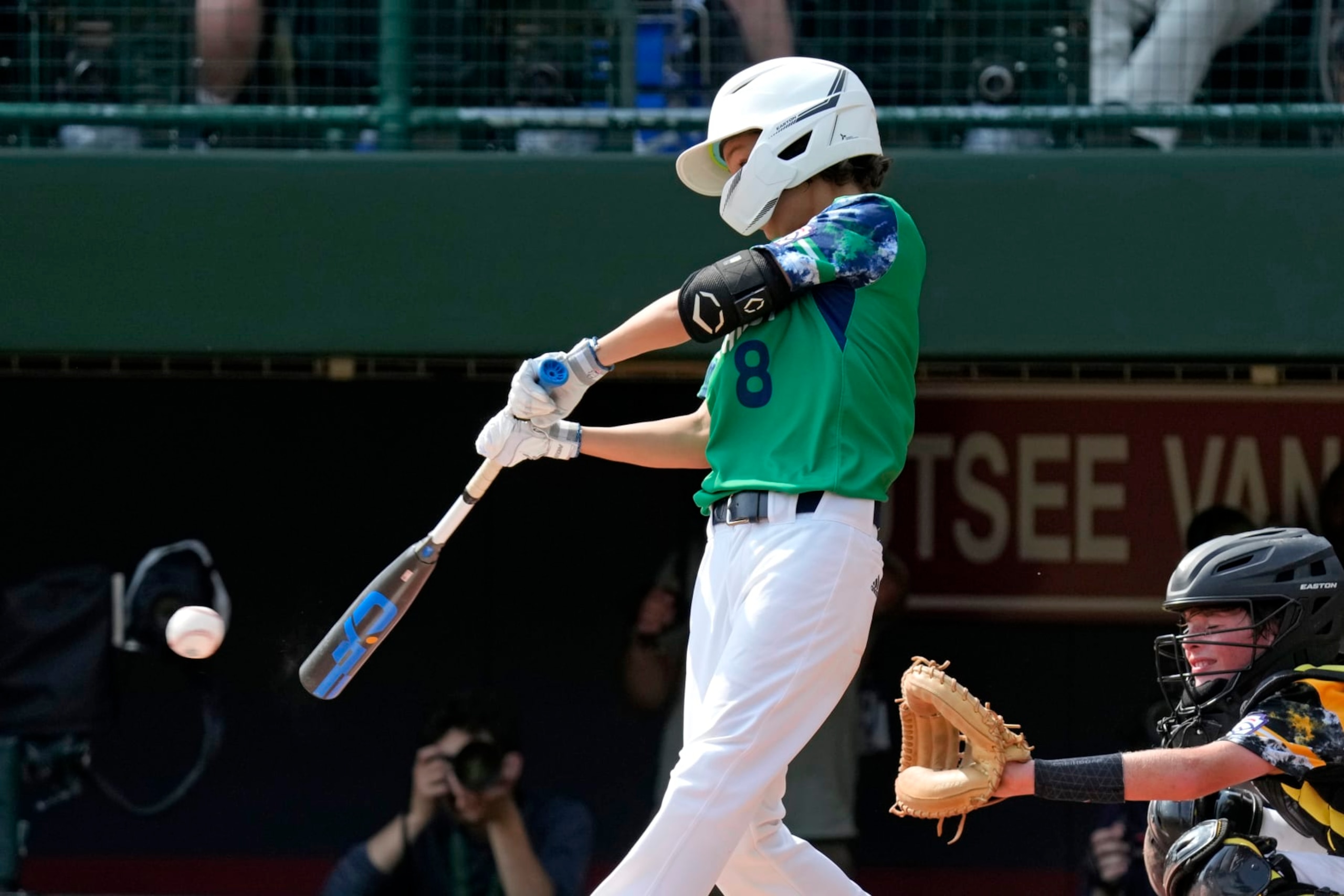 Seattle, Wash.'s Sam Santos (8) singles off Nolensville, Tenn.'s Lucas McCauley, driving in a run, during the second inning of a baseball game at the Little League World Series in South Williamsport, Pa., Monday, Aug. 21, 2021. (AP Photo/Gene J. Puskar)