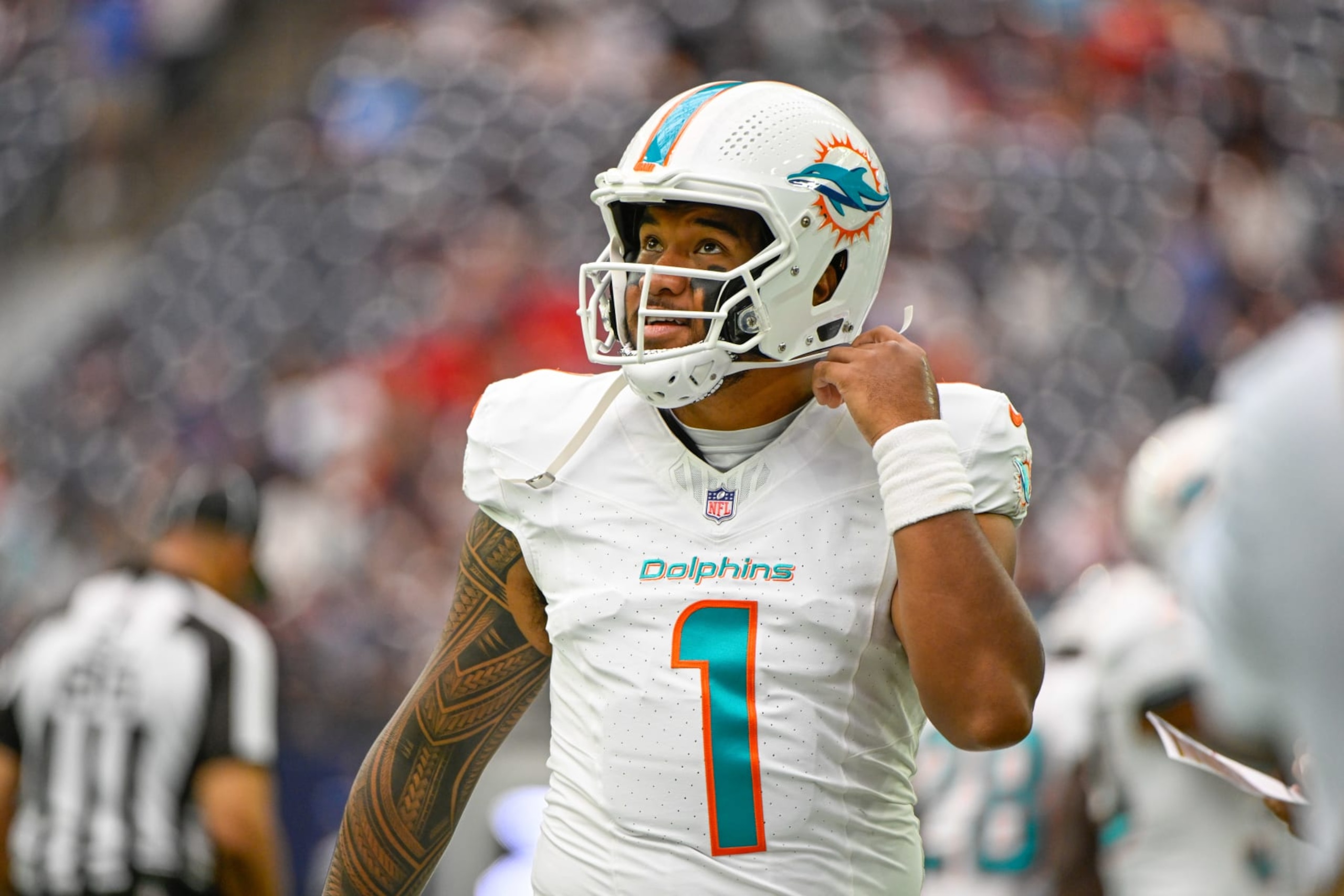HOUSTON, TX - AUGUST 19: Miami Dolphins quarterback Tua Tagovailoa (1) prepars for the first offensive series during the football game between the Miami Dolphins and Houston Texans at NRG Stadium on August, 19, 2023 in Houston, Texas. (Photo by Ken Murray/Icon Sportswire via Getty Images)