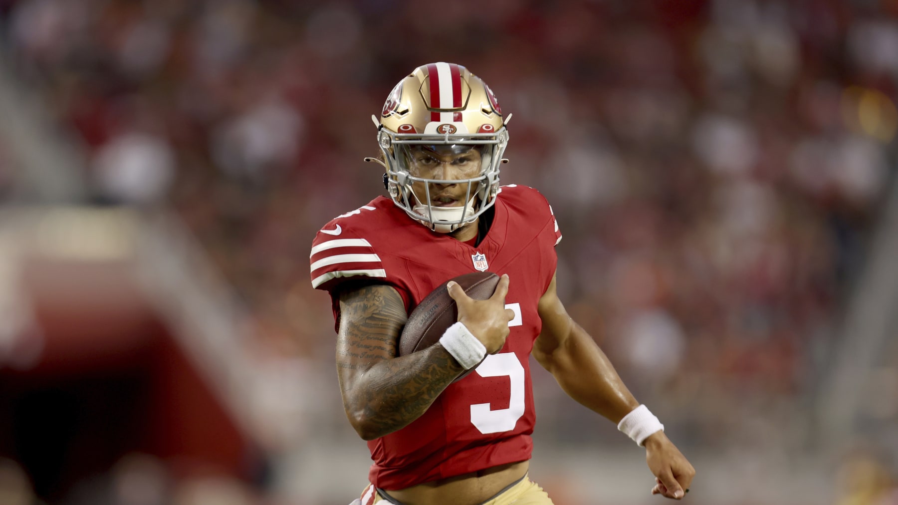 San Francisco 49ers quarterback Trey Lance (5) runs against the Denver Broncos during the second half of an NFL preseason football game in Santa Clara, Calif., Saturday, Aug. 19, 2023. (AP Photo/Jed Jacobsohn)