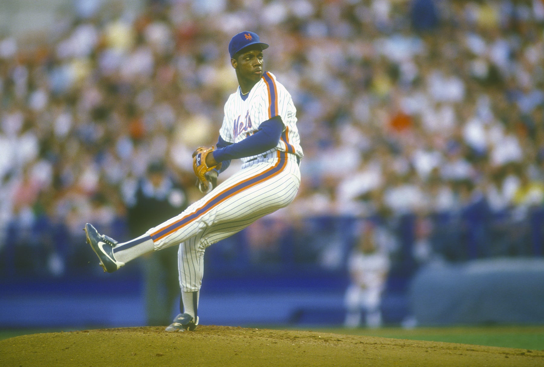NEW YORK - CIRCA 1988: Dwight Gooden #16 of the New York Mets pitches during a Major League Baseball game circa 1988 at Shea Stadium in the Queens borough of New York City. Gooden played for the Mets from 1984-94. (Photo by Focus on Sport/Getty Images)