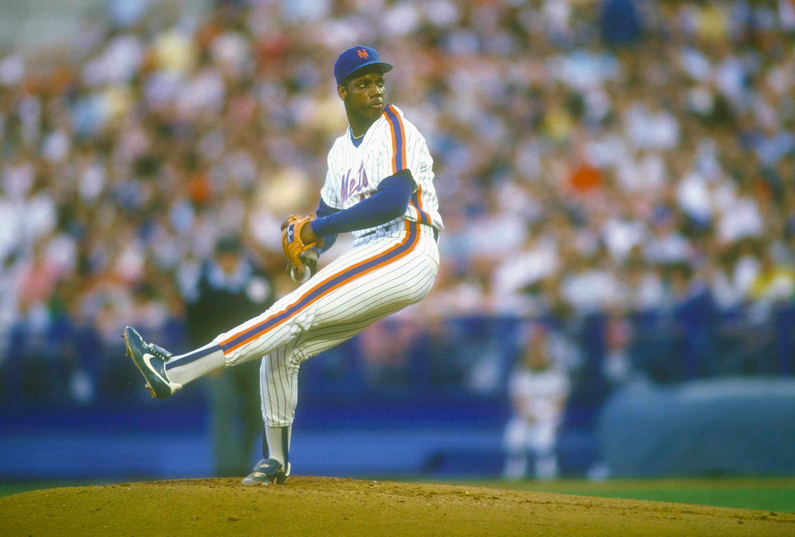 NEW YORK - CIRCA 1988: Dwight Gooden #16 of the New York Mets pitches during a Major League Baseball game circa 1988 at Shea Stadium in the Queens borough of New York City. Gooden played for the Mets from 1984-94. (Photo by Focus on Sport/Getty Images)