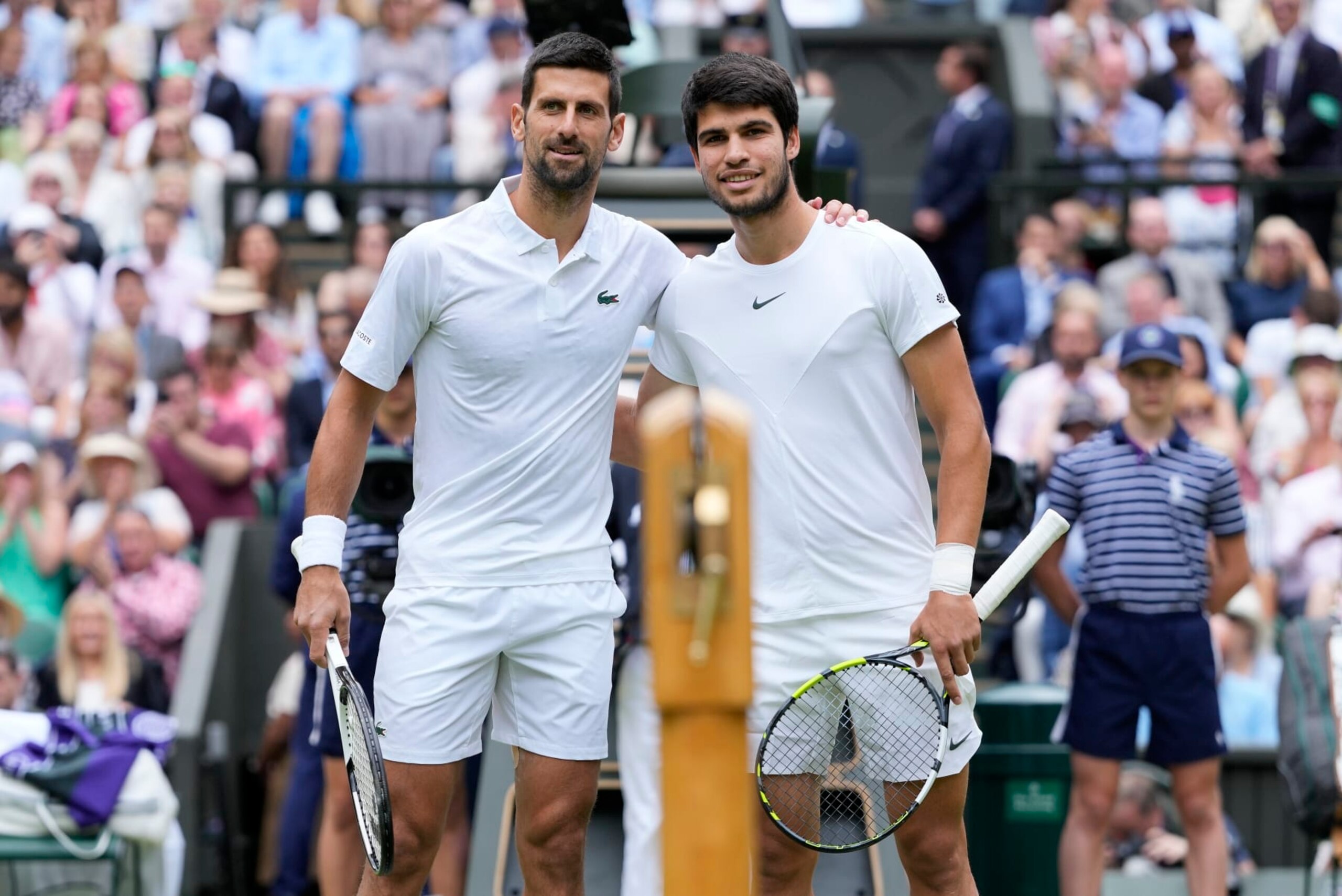 FILE - Serbia's Novak Djokovic, left, and Spain's Carlos Alcaraz pose for a photo ahead of the final of the men's singles on day fourteen of the Wimbledon tennis championships in London, Sunday, July 16, 2023. Tennis is in a state of transition as the U.S. Open is set to begin on Aug. 28. (AP Photo/Kirsty Wigglesworth, File)