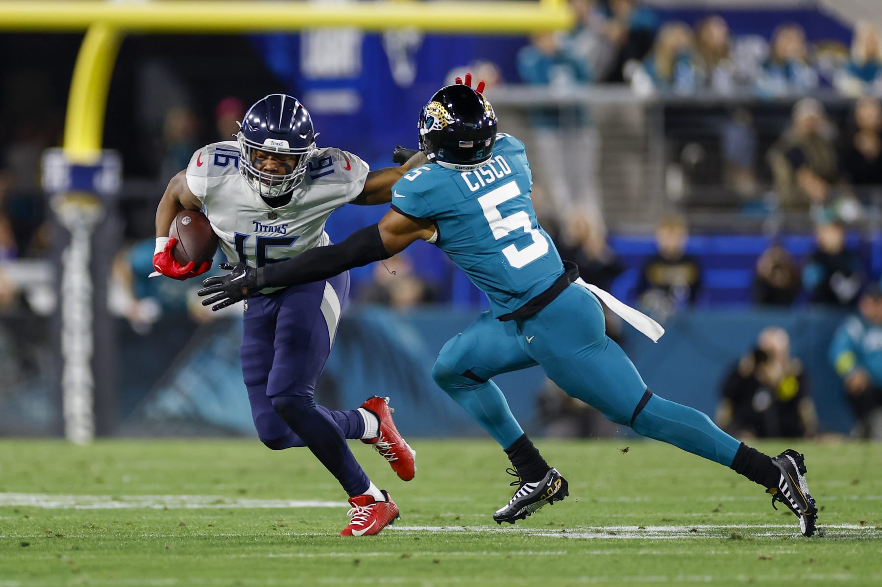 JACKSONVILLE, FL - JANUARY 07: Tennessee Titans wide receiver Treylon Burks (16) stiff-arms Jacksonville Jaguars safety Andre Cisco (5) during the game between the Tennessee Titans and the Jacksonville Jaguars and the  on January 7, 2023 at TIAA Bank Field in Jacksonville, Fl. (Photo by David Rosenblum/Icon Sportswire via Getty Images)