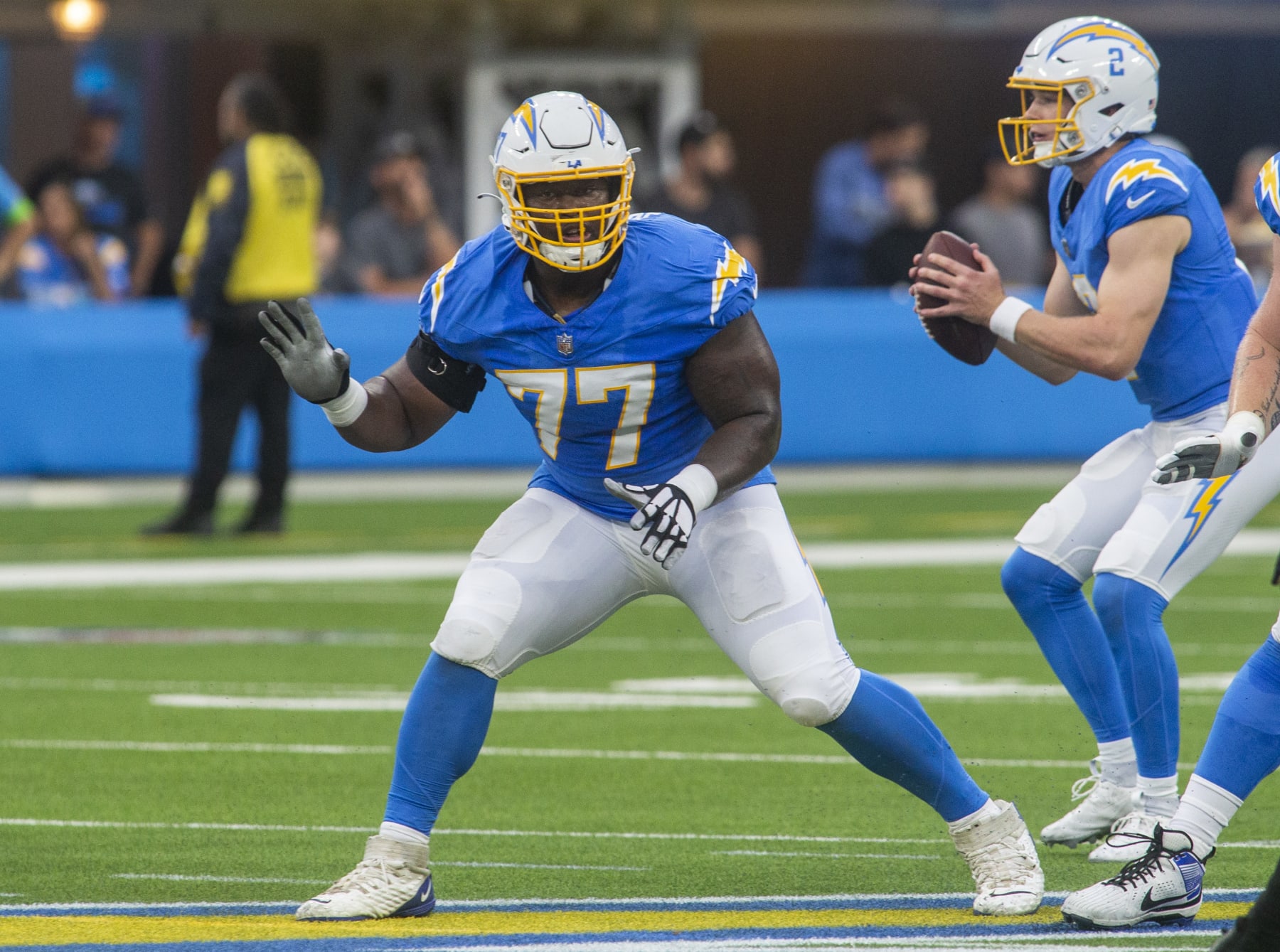 INGLEWOOD, CA - AUGUST 20: Los Angeles Chargers guard Zion Johnson (77) blocks in the first half of a preseason NFL football game between the New Orleans Saints and Los Angeles Chargers at SoFi Stadium in Inglewood, California. (Photo by Tony Ding/Icon Sportswire via Getty Images)