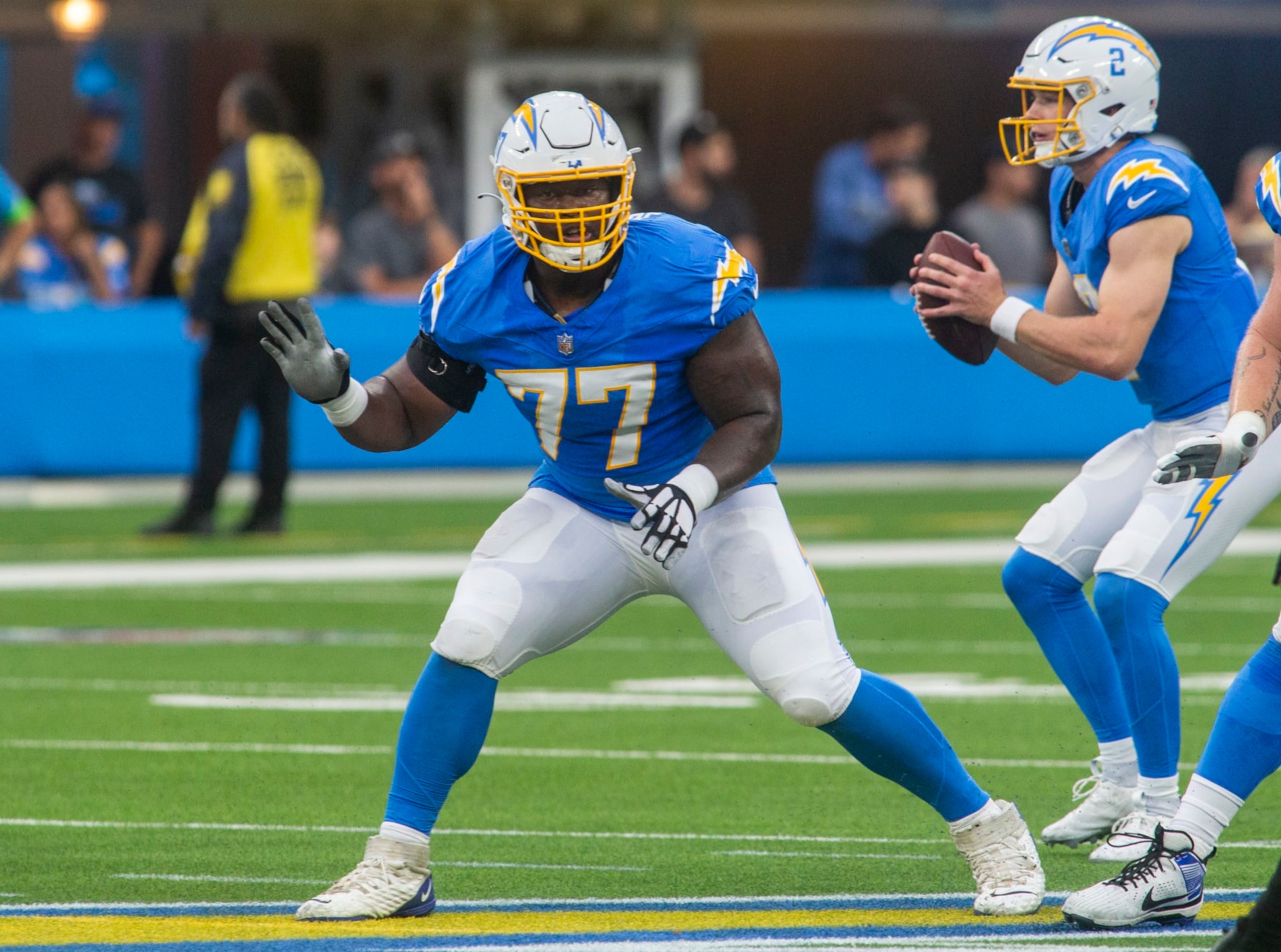 INGLEWOOD, CA - AUGUST 20: Los Angeles Chargers guard Zion Johnson (77) blocks in the first half of a preseason NFL football game between the New Orleans Saints and Los Angeles Chargers at SoFi Stadium in Inglewood, California. (Photo by Tony Ding/Icon Sportswire via Getty Images)
