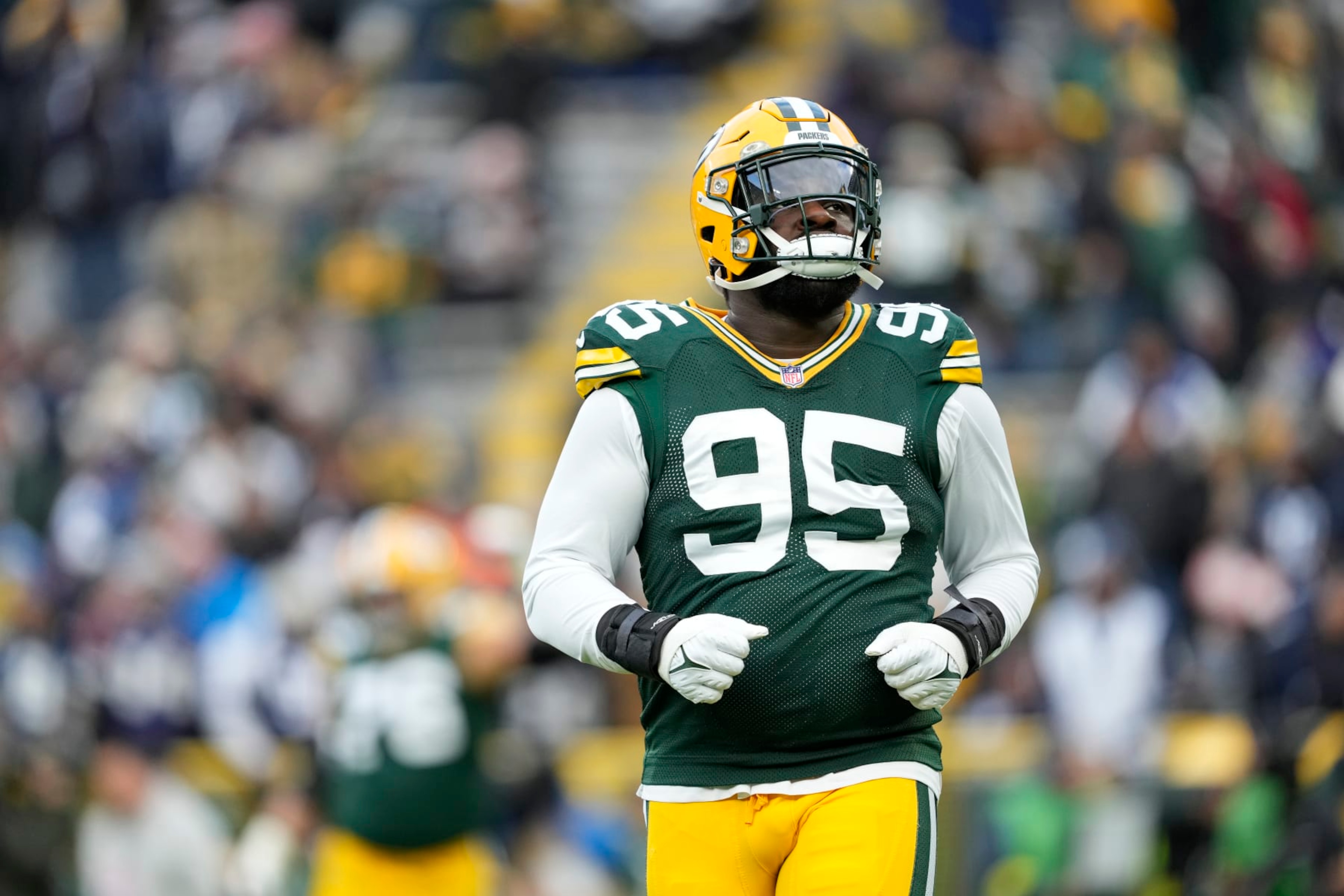 GREEN BAY, WISCONSIN - NOVEMBER 13: Devonte Wyatt #95 of the Green Bay Packers looks on before a game against the Dallas Cowboys at Lambeau Field on November 13, 2022 in Green Bay, Wisconsin. (Photo by Patrick McDermott/Getty Images) GREEN BAY, WISCONSIN - NOVEMBER 13: Devonte Wyatt #95 of the Green Bay Packers looks on before a game against the Dallas Cowboys at Lambeau Field on November 13, 2022 in Green Bay, Wisconsin. (Photo by Patrick McDermott/Getty Images)