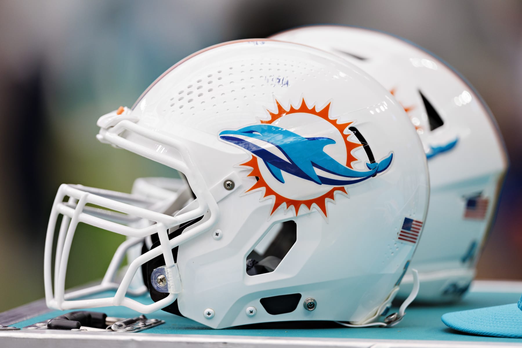 HOUSTON, TEXAS - AUGUST 19:  Helmet of the Miami Dolphins on the sidelines during the preseason game against the Houston Texans at NRG Stadium on August 19, 2023 in Houston, Texas. The Dolphins defeated the Texans 28-3.  (Photo by Wesley Hitt/Getty Images)