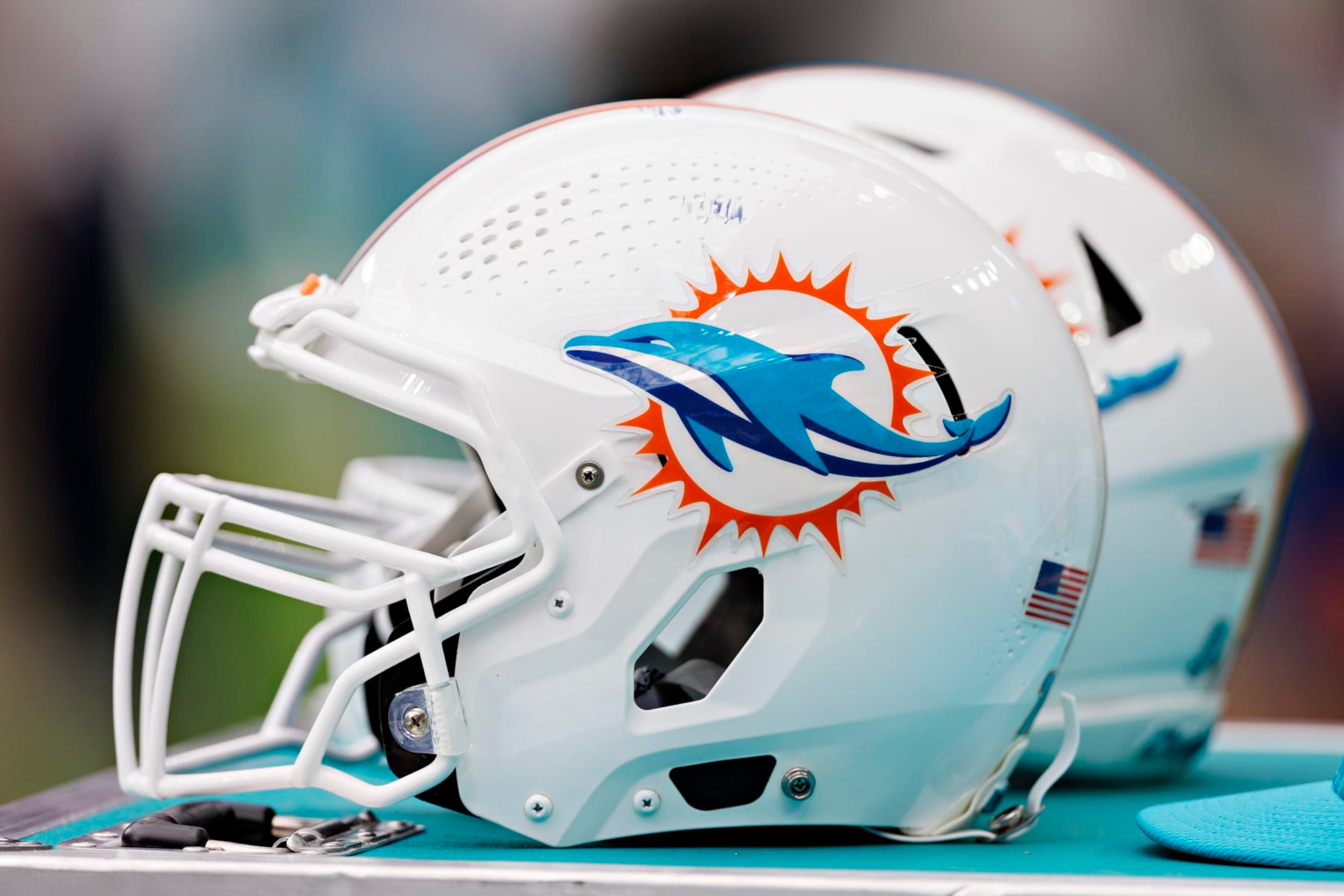 HOUSTON, TEXAS - AUGUST 19:  Helmet of the Miami Dolphins on the sidelines during the preseason game against the Houston Texans at NRG Stadium on August 19, 2023 in Houston, Texas. The Dolphins defeated the Texans 28-3.  (Photo by Wesley Hitt/Getty Images)