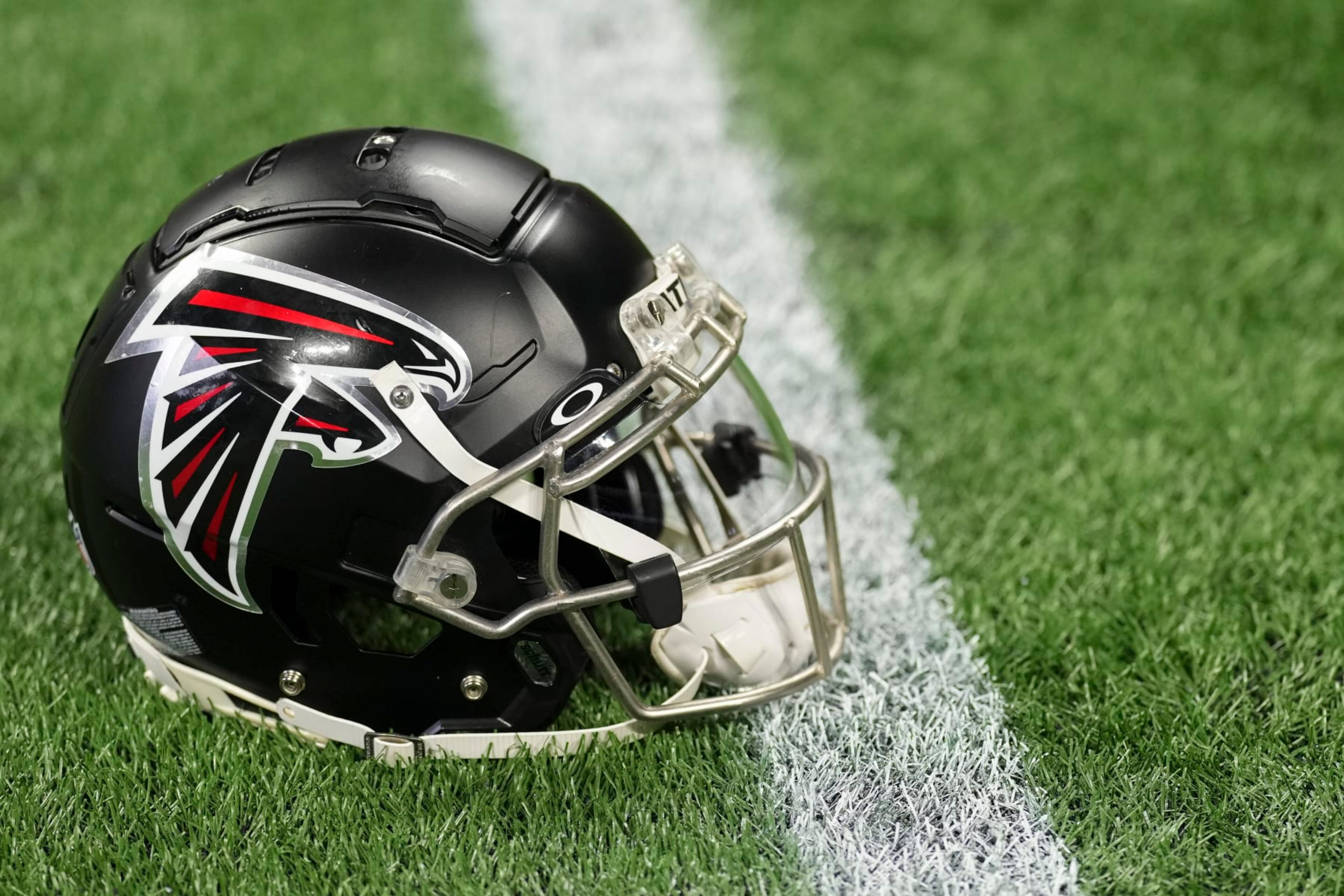 ATLANTA, GA - JANUARY 08: A close up view of an Atlanta Falcons helmet on the turf prior to the game against the Tampa Bay Buccaneers at Mercedes-Benz Stadium on January 8, 2023 in Atlanta, Georgia. (Photo by Cooper Neill/Getty Images) ATLANTA, GA - JANUARY 08: A close up view of an Atlanta Falcons helmet on the turf prior to the game against the Tampa Bay Buccaneers at Mercedes-Benz Stadium on January 8, 2023 in Atlanta, Georgia. (Photo by Cooper Neill/Getty Images)