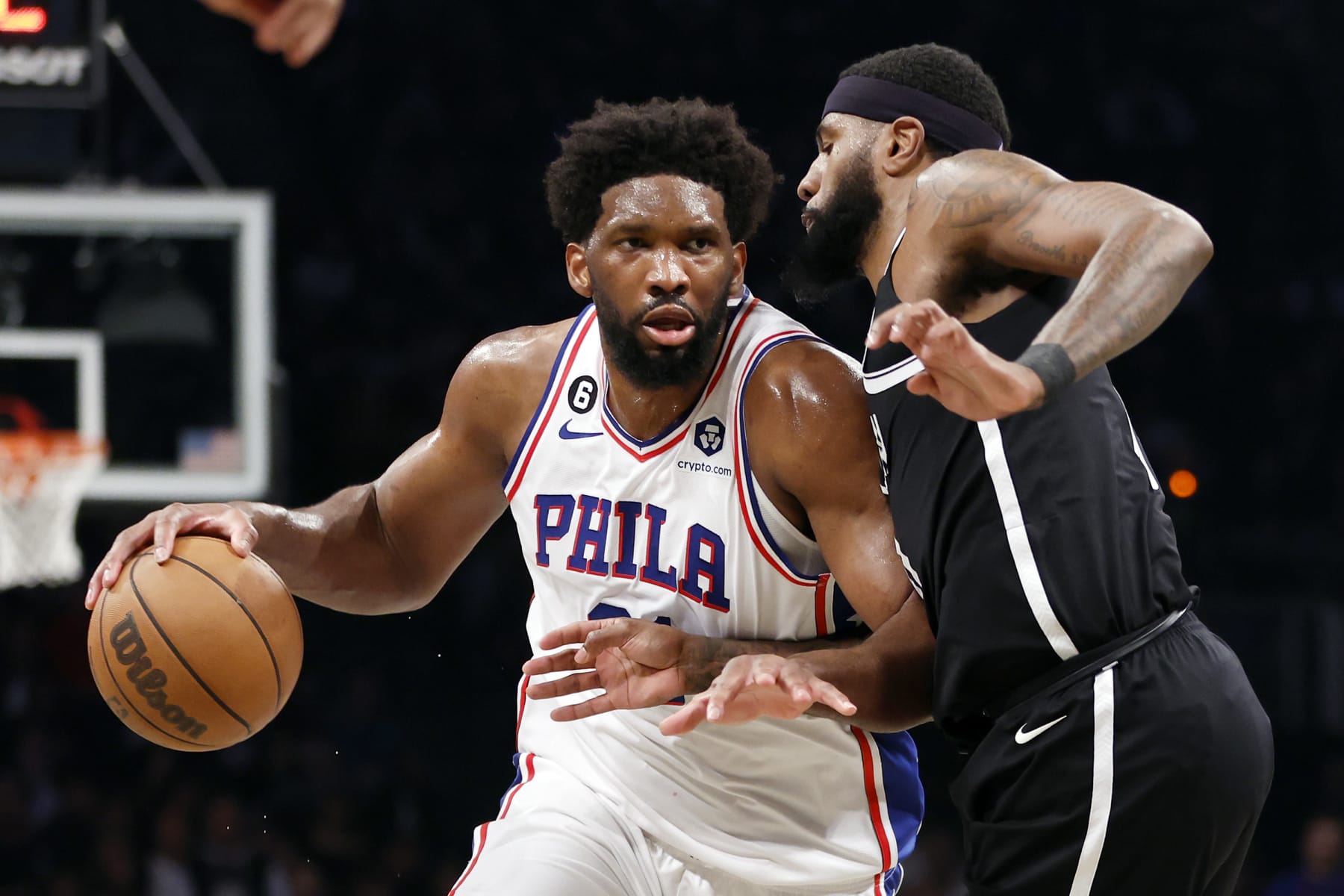 NEW YORK, NEW YORK - APRIL 20: Joel Embiid #21 of the Philadelphia 76ers dribbles against Royce O'Neale #00 of the Brooklyn Nets during the second half of Game Three of the Eastern Conference First Round Playoffs at Barclays Center on April 20, 2023 in the Brooklyn borough of New York City. The 76ers won 102-97. NOTE TO USER: User expressly acknowledges and agrees that, by downloading and or using this photograph, User is consenting to the terms and conditions of the Getty Images License Agreement. (Photo by Sarah Stier/Getty Images)