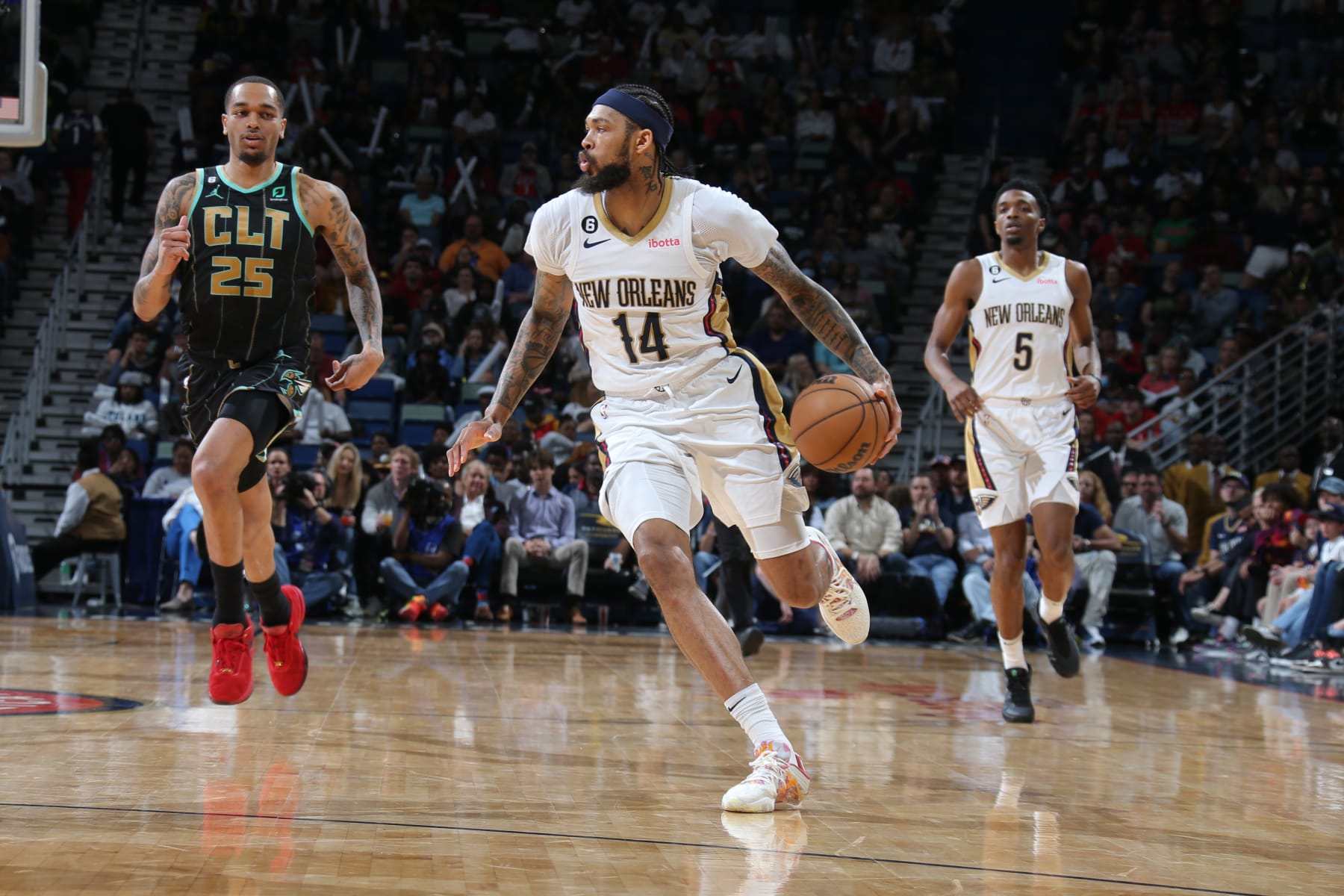 NEW ORLEANS, LA - MARCH 23: Brandon Ingram #14 of the New Orleans Pelicans dribbles the ball during the game against the Charlotte Hornets on March 23, 2023 at the Smoothie King Center in New Orleans, Louisiana. NOTE TO USER: User expressly acknowledges and agrees that, by downloading and or using this Photograph, user is consenting to the terms and conditions of the Getty Images License Agreement. Mandatory Copyright Notice: Copyright 2023 NBAE (Photo by Layne Murdoch Jr./NBAE via Getty Images)