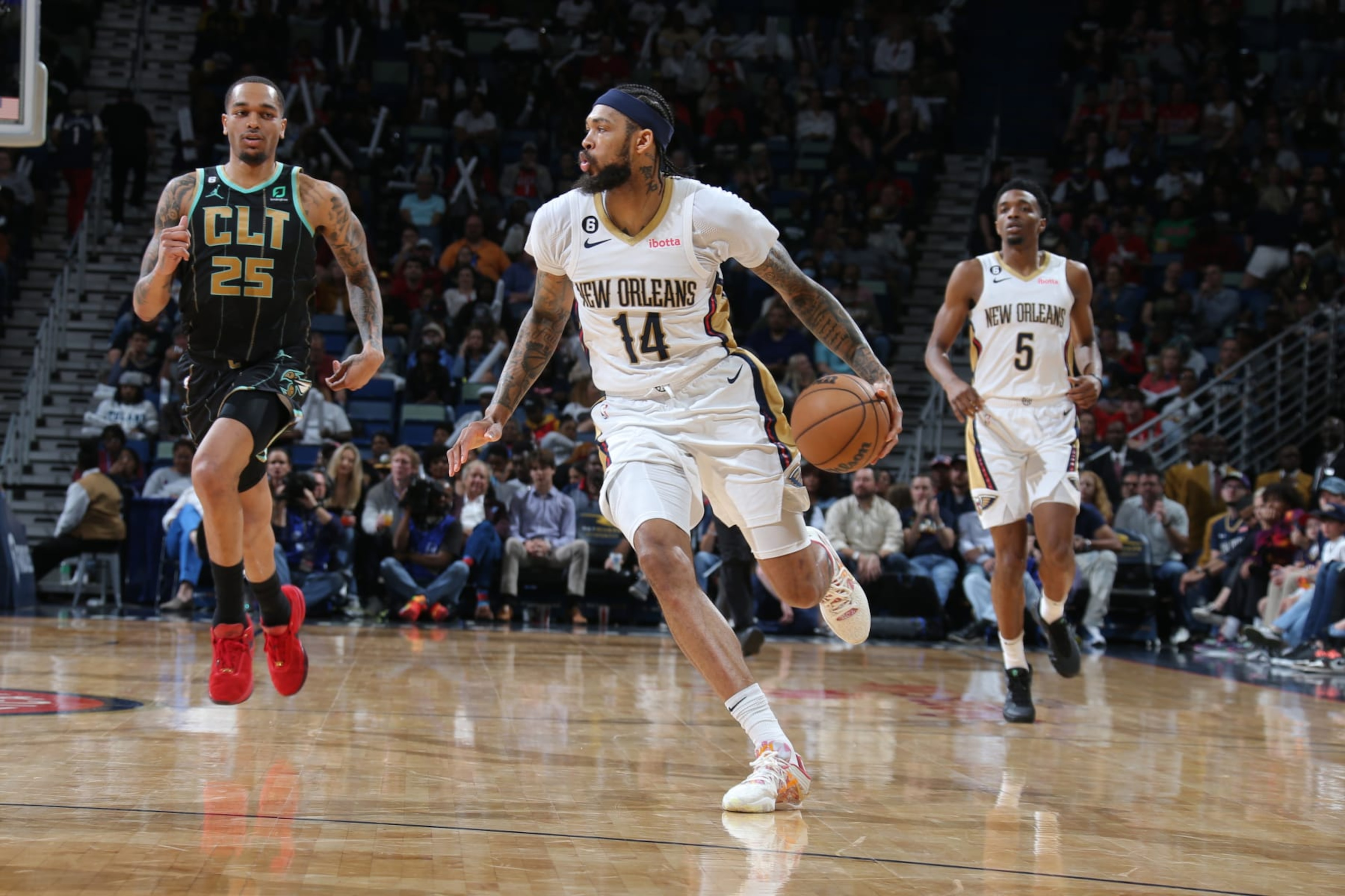 NEW ORLEANS, LA - MARCH 23: Brandon Ingram #14 of the New Orleans Pelicans dribbles the ball during the game against the Charlotte Hornets on March 23, 2023 at the Smoothie King Center in New Orleans, Louisiana. NOTE TO USER: User expressly acknowledges and agrees that, by downloading and or using this Photograph, user is consenting to the terms and conditions of the Getty Images License Agreement. Mandatory Copyright Notice: Copyright 2023 NBAE (Photo by Layne Murdoch Jr./NBAE via Getty Images) NEW ORLEANS, LA - MARCH 23: Brandon Ingram #14 of the New Orleans Pelicans dribbles the ball during the game against the Charlotte Hornets on March 23, 2023 at the Smoothie King Center in New Orleans, Louisiana. NOTE TO USER: User expressly acknowledges and agrees that, by downloading and or using this Photograph, user is consenting to the terms and conditions of the Getty Images License Agreement. Mandatory Copyright Notice: Copyright 2023 NBAE (Photo by Layne Murdoch Jr./NBAE via Getty Images)