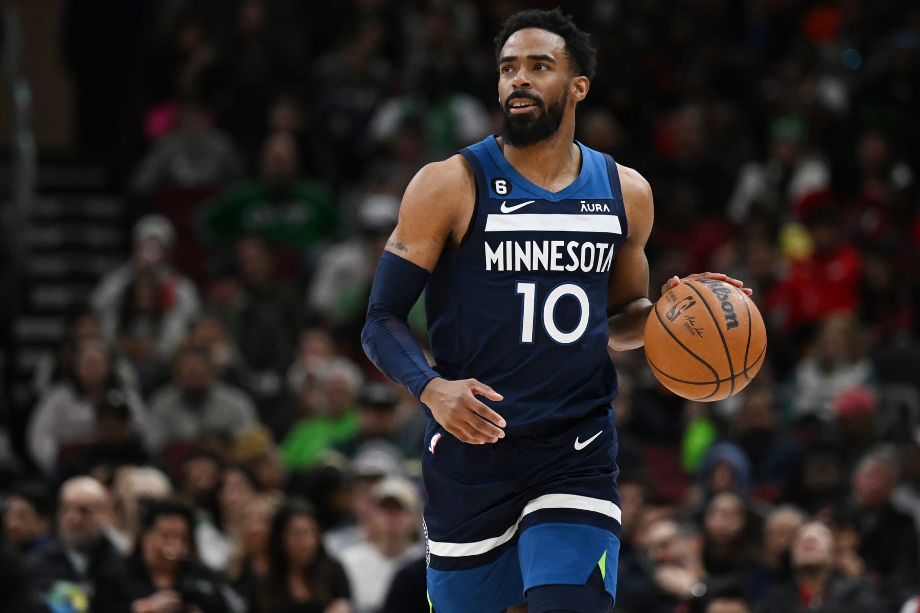 CHICAGO, ILLINOIS - MARCH 17: Mike Conley #10 of the Minnesota Timberwolves against the Chicago Bulls at United Center on March 17, 2023 in Chicago, Illinois.  NOTE TO USER: User expressly acknowledges and agrees that, by downloading and or using this photograph, User is consenting to the terms and conditions of the Getty Images License Agreement.  (Photo by Quinn Harris/Getty Images)