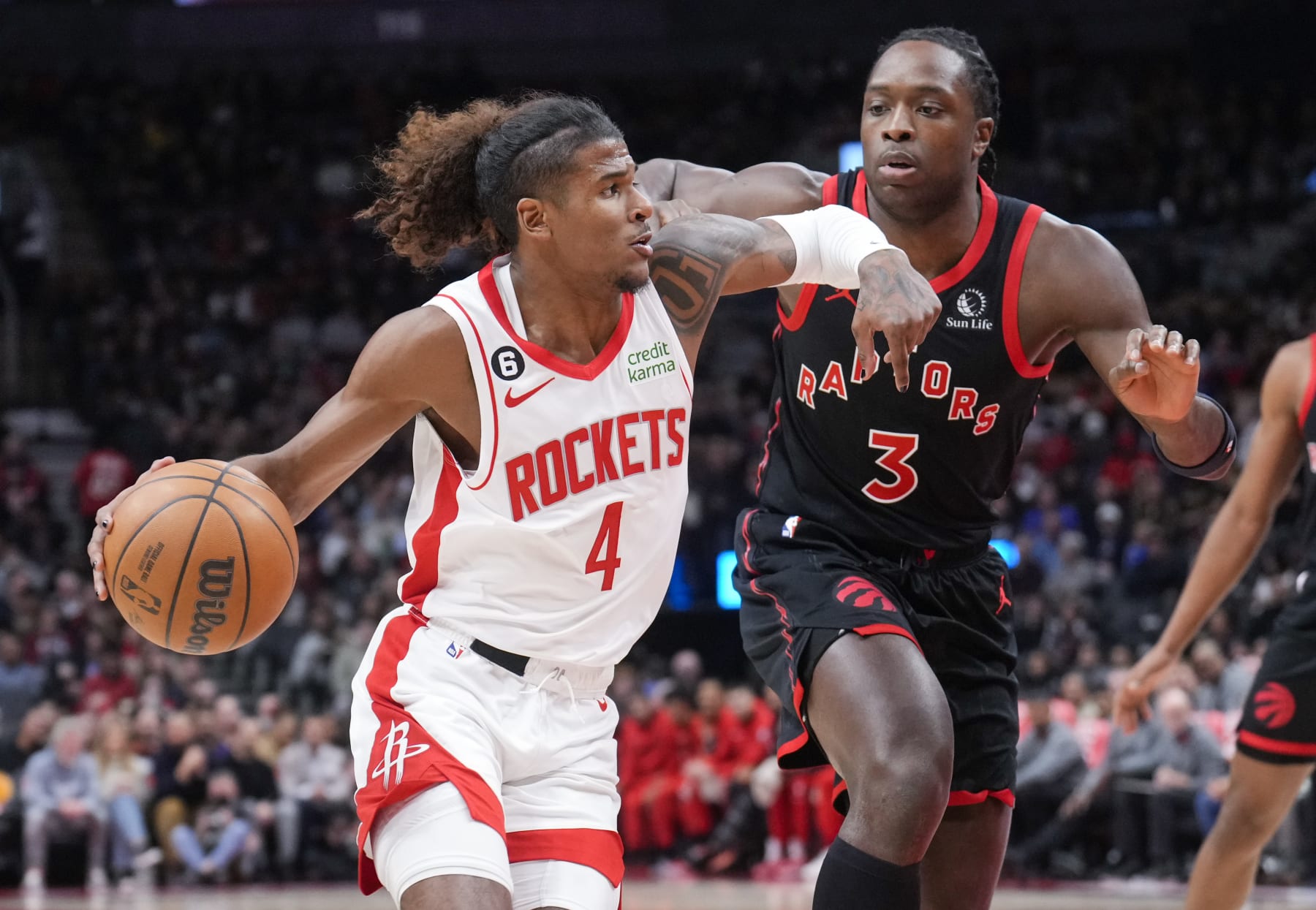 TORONTO, ON - NOVEMBER 9: Jalen Green #4 of the Houston Rockets drives against O.G. Anunoby #3 of the Toronto Raptors during the first half of their basketball game at the Scotiabank Arena on November 9, 2022 in Toronto, Ontario, Canada. NOTE TO USER: User expressly acknowledges and agrees that, by downloading and/or using this Photograph, user is consenting to the terms and conditions of the Getty Images License Agreement. (Photo by Mark Blinch/Getty Images)