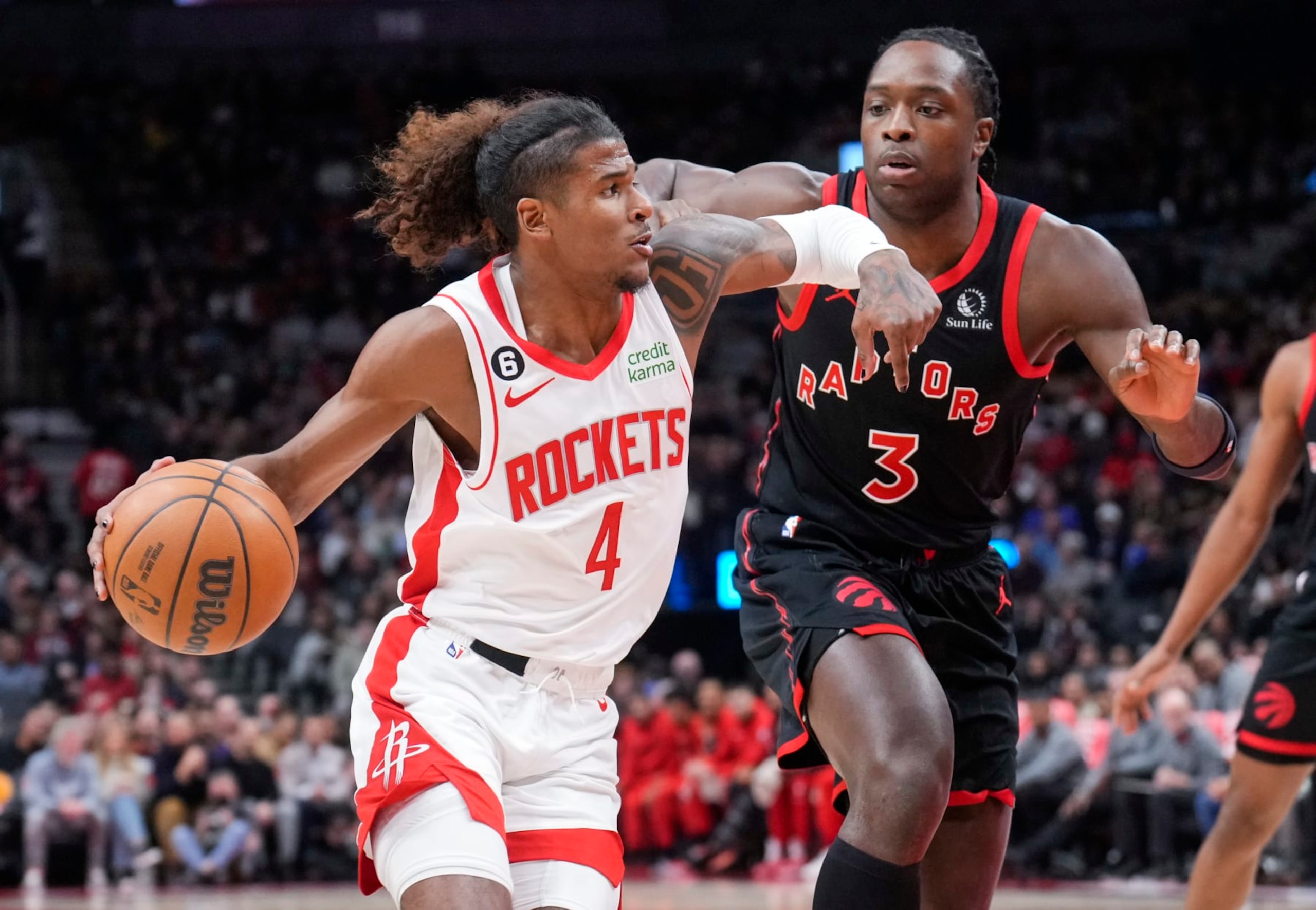 TORONTO, ON - NOVEMBER 9: Jalen Green #4 of the Houston Rockets drives against O.G. Anunoby #3 of the Toronto Raptors during the first half of their basketball game at the Scotiabank Arena on November 9, 2022 in Toronto, Ontario, Canada. NOTE TO USER: User expressly acknowledges and agrees that, by downloading and/or using this Photograph, user is consenting to the terms and conditions of the Getty Images License Agreement. (Photo by Mark Blinch/Getty Images)