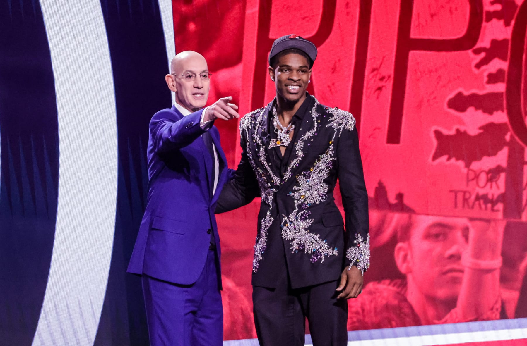 NEW YORK, UNITED STATES - JUNE 22: NBA commissioner Brandon Miller (L) shakes hands with Scoot Henderson (R) during the first overall pick by the San Antonio Spurs at Barclays Center in Brooklyn, New York City on June 22, 2023. (Photo by Selcuk Acar/Anadolu Agency via Getty Images)