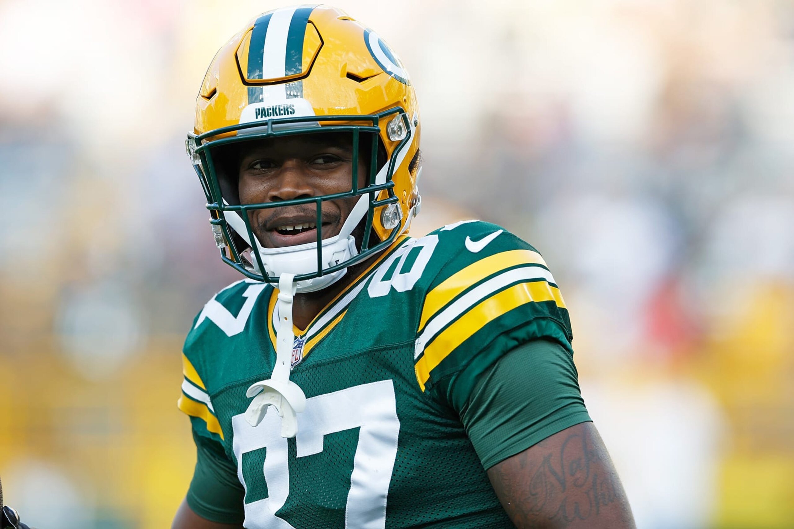 GREEN BAY, WISCONSIN - AUGUST 19: Romeo Doubs #87 of the Green Bay Packers warms up before the preseason game 
against the New England Patriots at Lambeau Field on August 19, 2023 in Green Bay, Wisconsin. (Photo by John Fisher/Getty Images)