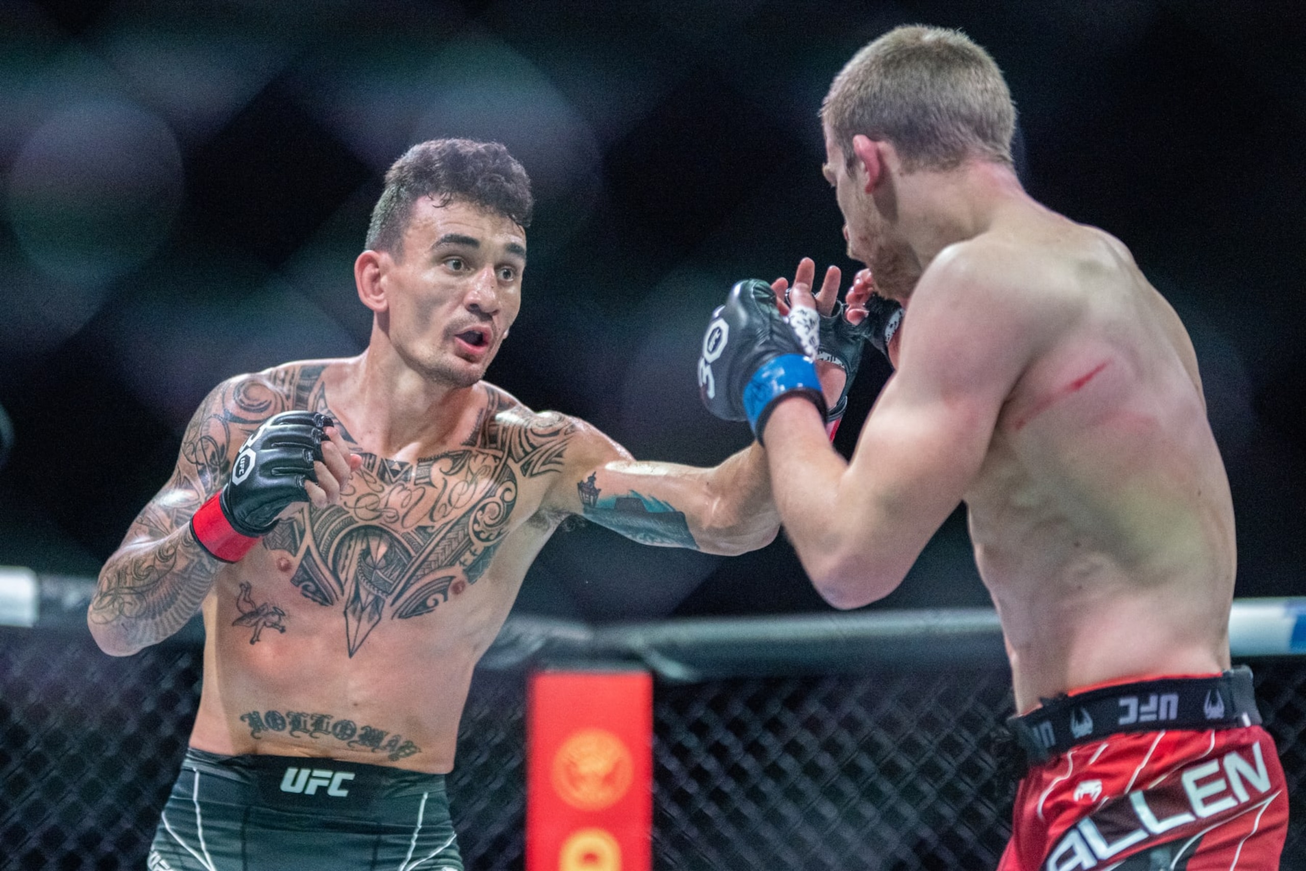 Max Holloway (left) in a fight with Arnold Allen (right) Max Holloway (left) in a fight with Arnold Allen (right)