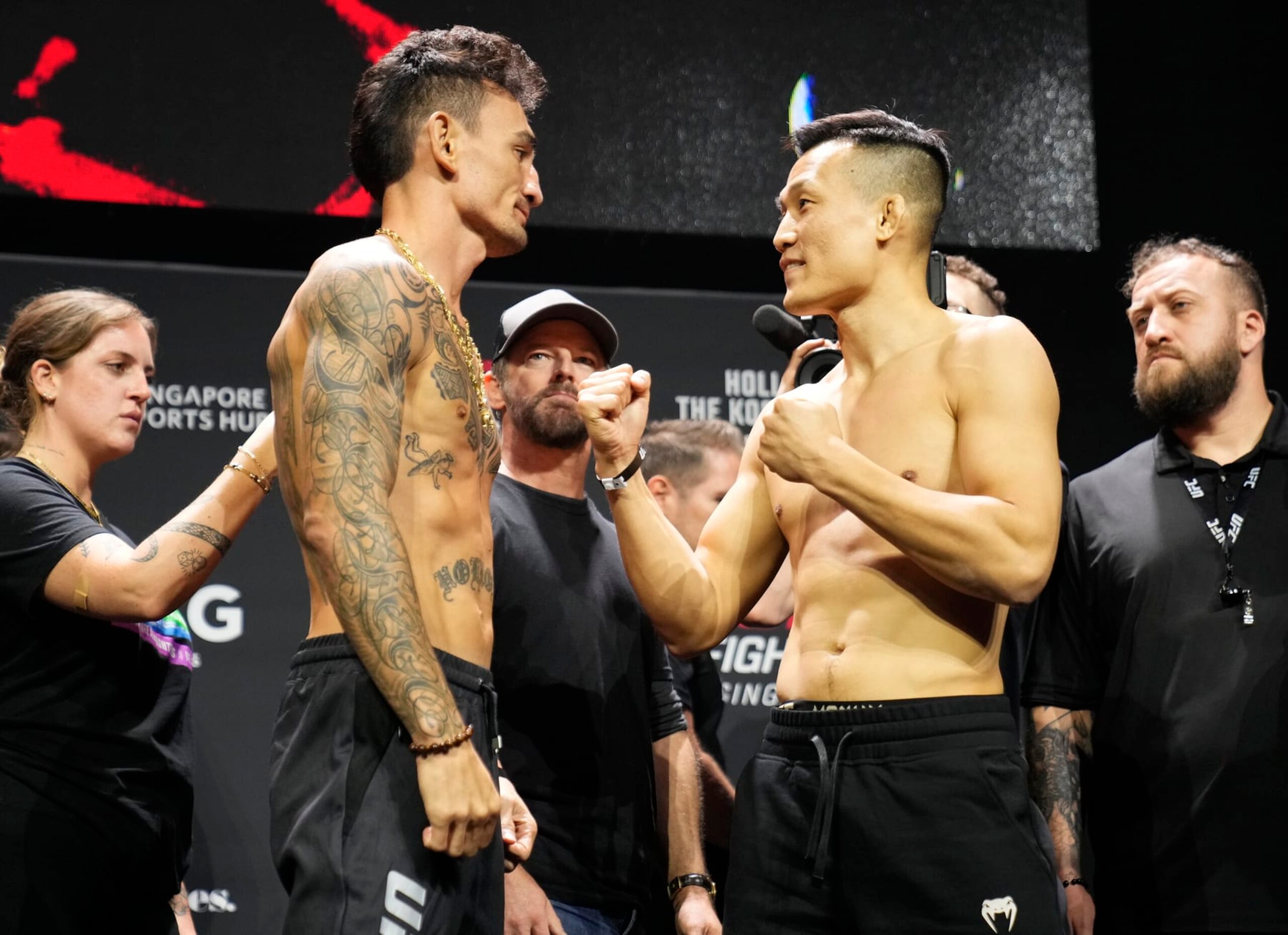 SINGAPORE, SINGAPORE - AUGUST 25: (L-R) Opponents Max Holloway and Chan Sung Jung of South Korea face off during the UFC Fight Night ceremonial weigh-in at Singapore Indoor Stadium on August 25, 2023 in Singapore. (Photo by Mike Roach/Zuffa LLC via Getty Images) SINGAPORE, SINGAPORE - AUGUST 25: (L-R) Opponents Max Holloway and Chan Sung Jung of South Korea face off during the UFC Fight Night ceremonial weigh-in at Singapore Indoor Stadium on August 25, 2023 in Singapore. (Photo by Mike Roach/Zuffa LLC via Getty Images)