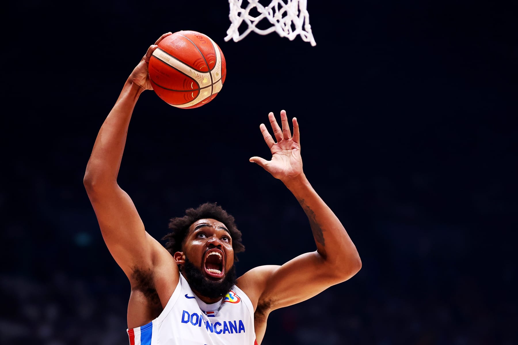 BULACAN, PHILIPPINES - AUGUST 25: Karl-Anthony Towns #32 of the Dominican Republic drives to the basket in the third quarter during the FIBA World Cup Group A game against the Philippines at the Philippine Arena on August 25, 2023 in Bulacan, Philippines. (Photo by Yong Teck Lim/Getty Images)