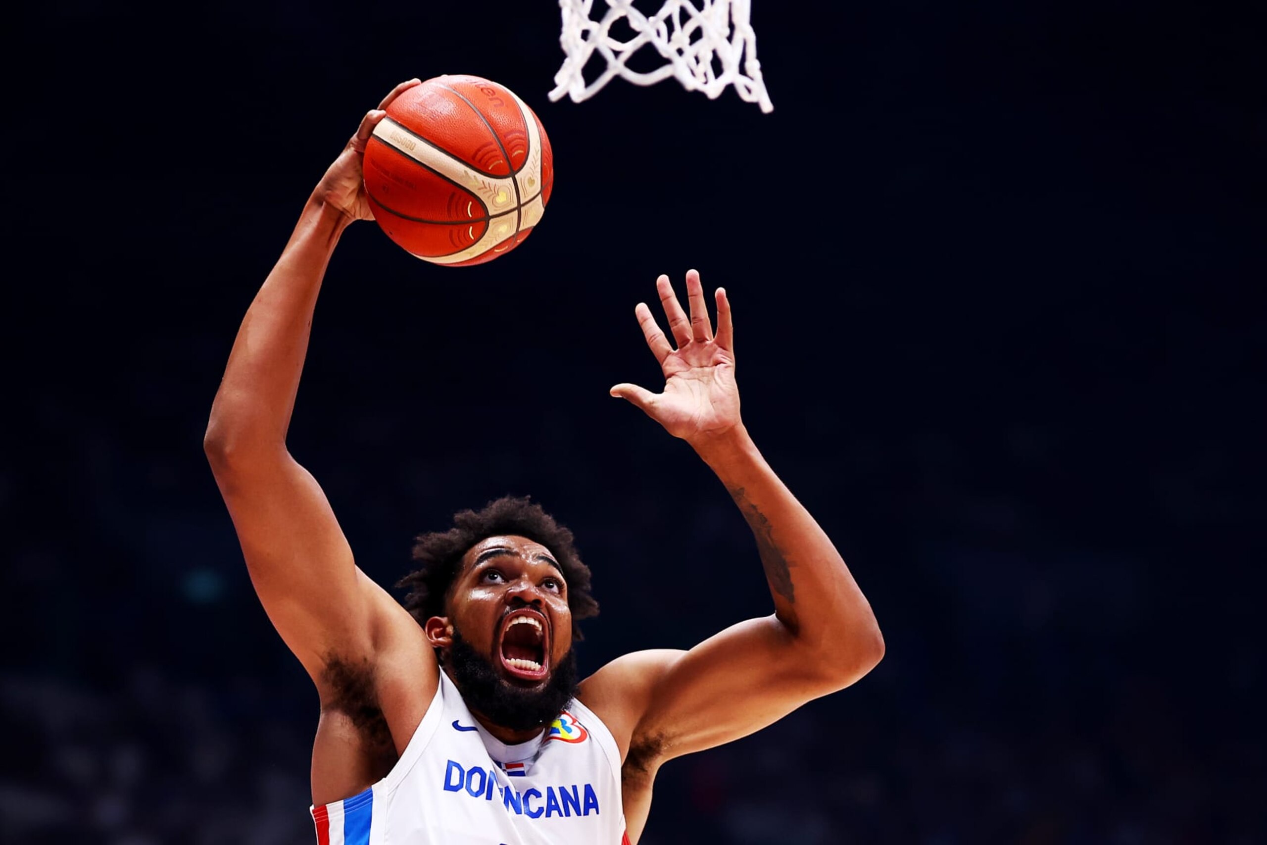 BULACAN, PHILIPPINES - AUGUST 25: Karl-Anthony Towns #32 of the Dominican Republic drives to the basket in the third quarter during the FIBA World Cup Group A game against the Philippines at the Philippine Arena on August 25, 2023 in Bulacan, Philippines. (Photo by Yong Teck Lim/Getty Images)