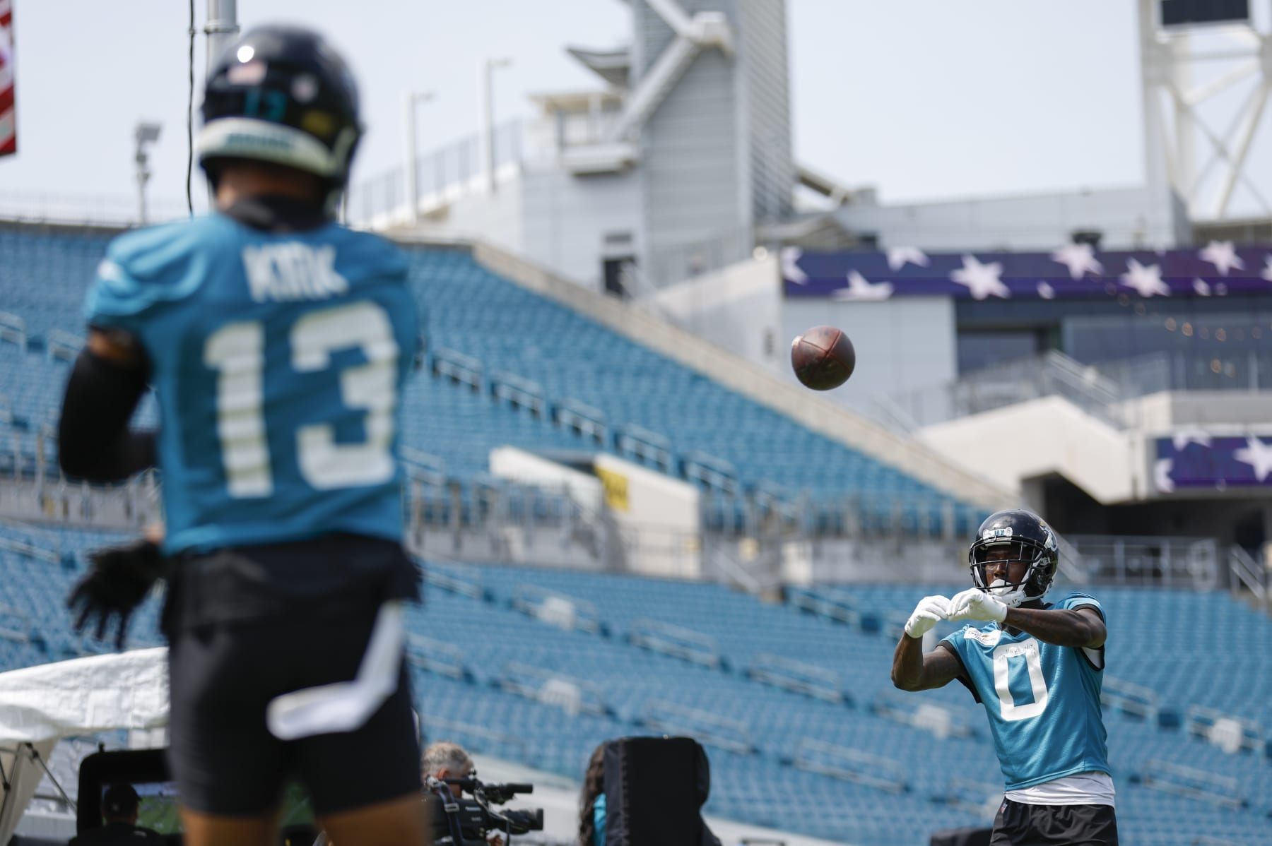JACKSONVILLE, FL - JUNE 05: Jacksonville Jaguars Wide Receiver Calvin Ridley (0) catches a pass from Jacksonville Jaguars Wide Receiver Christian Kirk (13) during the Jacksonville Jaguars OTA on June 5, 2023 at TIAA Bank Field in Jacksonville, Fl. (Photo by David Rosenblum/Icon Sportswire via Getty Images)