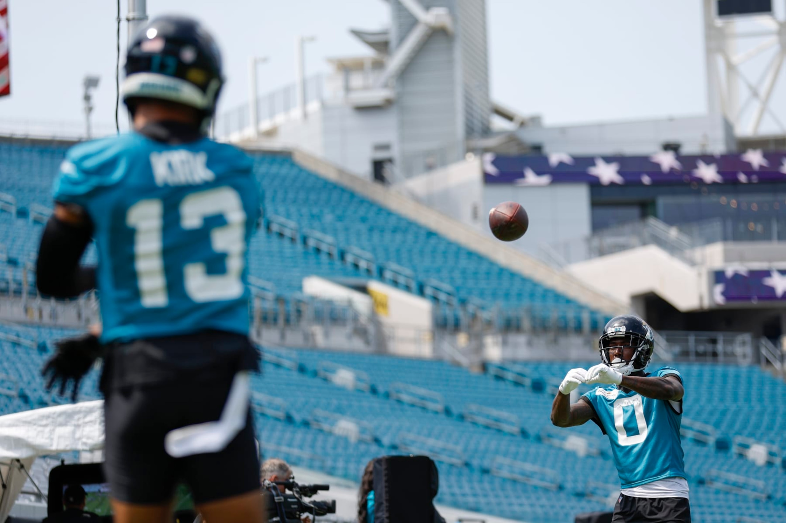 JACKSONVILLE, FL - JUNE 05: Jacksonville Jaguars Wide Receiver Calvin Ridley (0) catches a pass from Jacksonville Jaguars Wide Receiver Christian Kirk (13) during the Jacksonville Jaguars OTA on June 5, 2023 at TIAA Bank Field in Jacksonville, Fl. (Photo by David Rosenblum/Icon Sportswire via Getty Images)