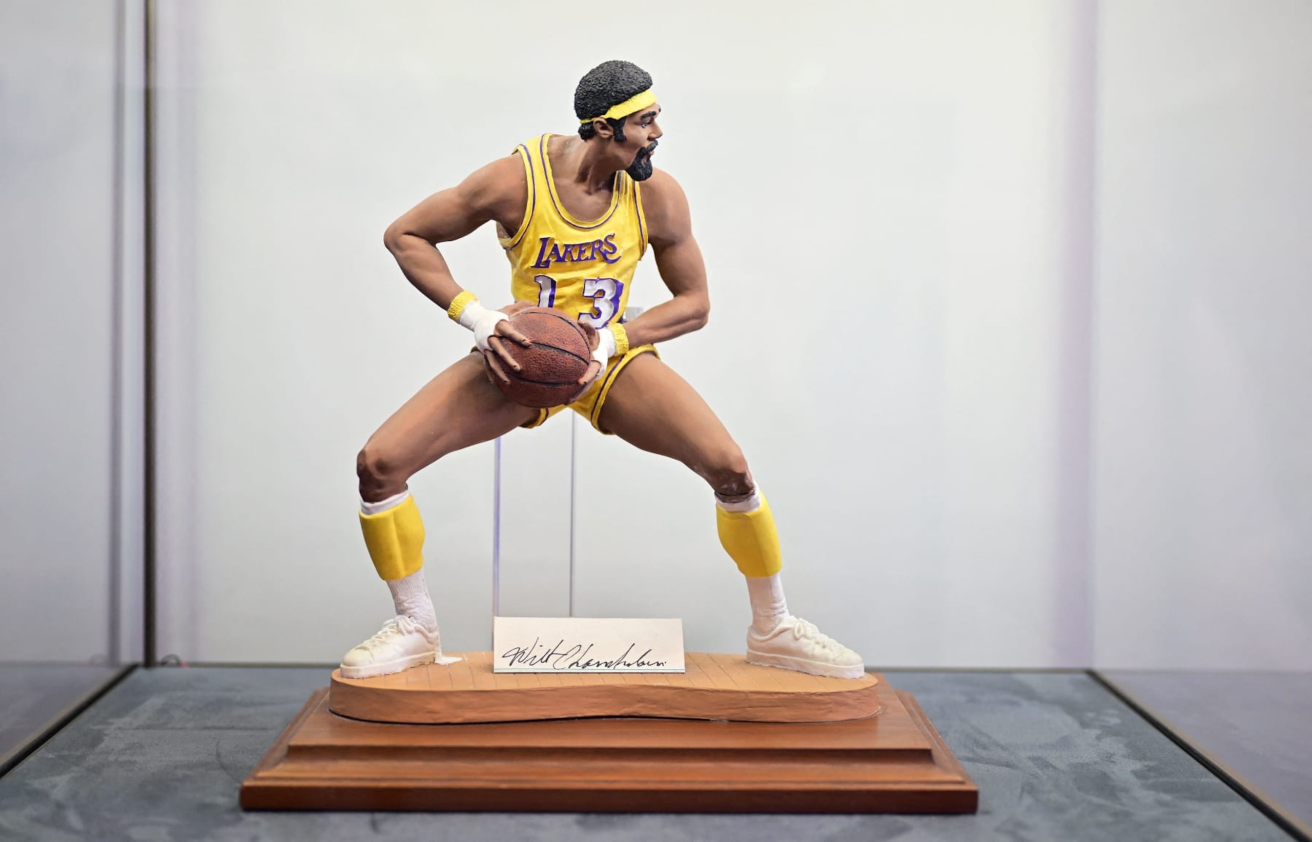A miniature statue of Wilt Chamberlain in his 'Championship Clinching' 1972 NBA Final jersey, with bandaged-hands after he broke a hand, is displayed at Sotheby's Auction House in Beverly Hills, California, on August 1, 2023. The jersey is estimated at $4 million. (Photo by Frederic J. BROWN / AFP) / *UNDER EMBARGO UNTIL WEDNESDAY, 2 AUGUST AT 9:00 ET* (Photo by FREDERIC J. BROWN/AFP via Getty Images)