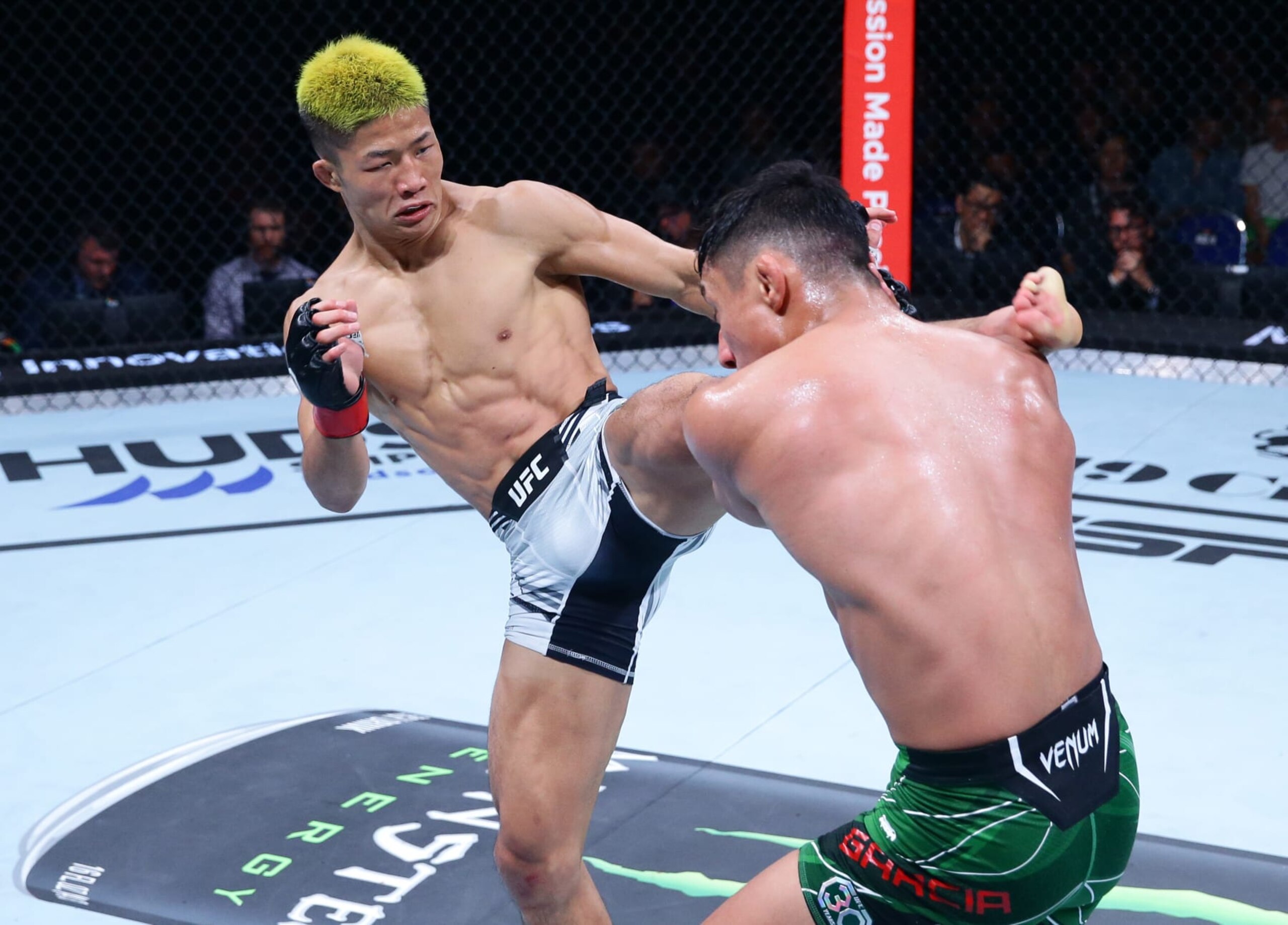 SINGAPORE, SINGAPORE - AUGUST 26: (L-R) Rinya Nakamura of Japan kicks Fernie Garcia in a bantamweight bout during the UFC Fight Night event at Singapore Indoor Stadium on August 26, 2023 in Singapore. (Photo by Suhaimi Abdullah/Zuffa LLC via Getty Images)