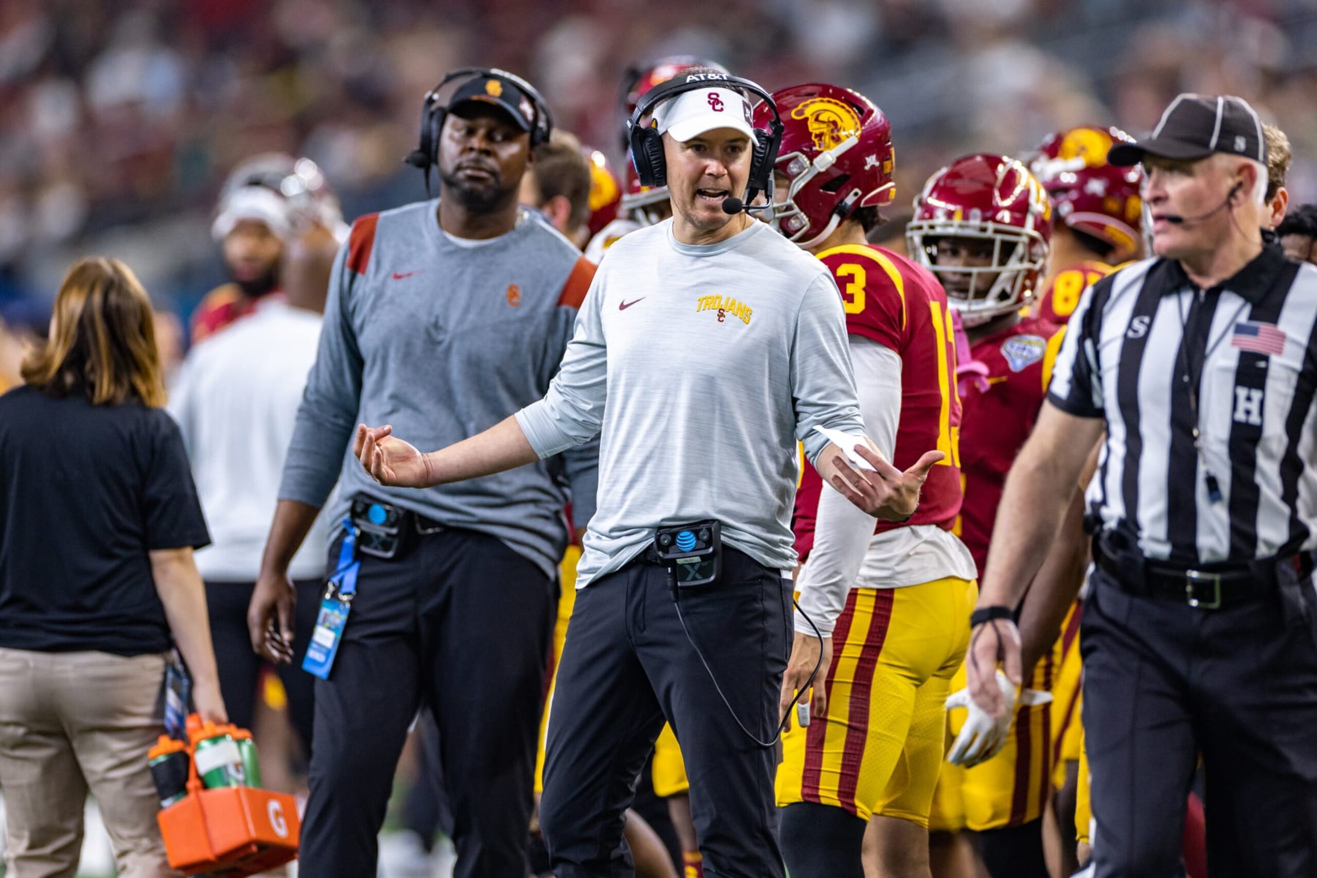 ARLINGTON, TX - JANUARY 02: USC Trojans head coach Lincoln Riley tries to get the referees attention on the sideline during the Goodyear Cotton Bowl game between the USC Trojans and Tulane Green Wave on January 02, 2023 at AT&T Stadium in Arlington, TX.  (Photo by Matthew Visinsky/Icon Sportswire via Getty Images)