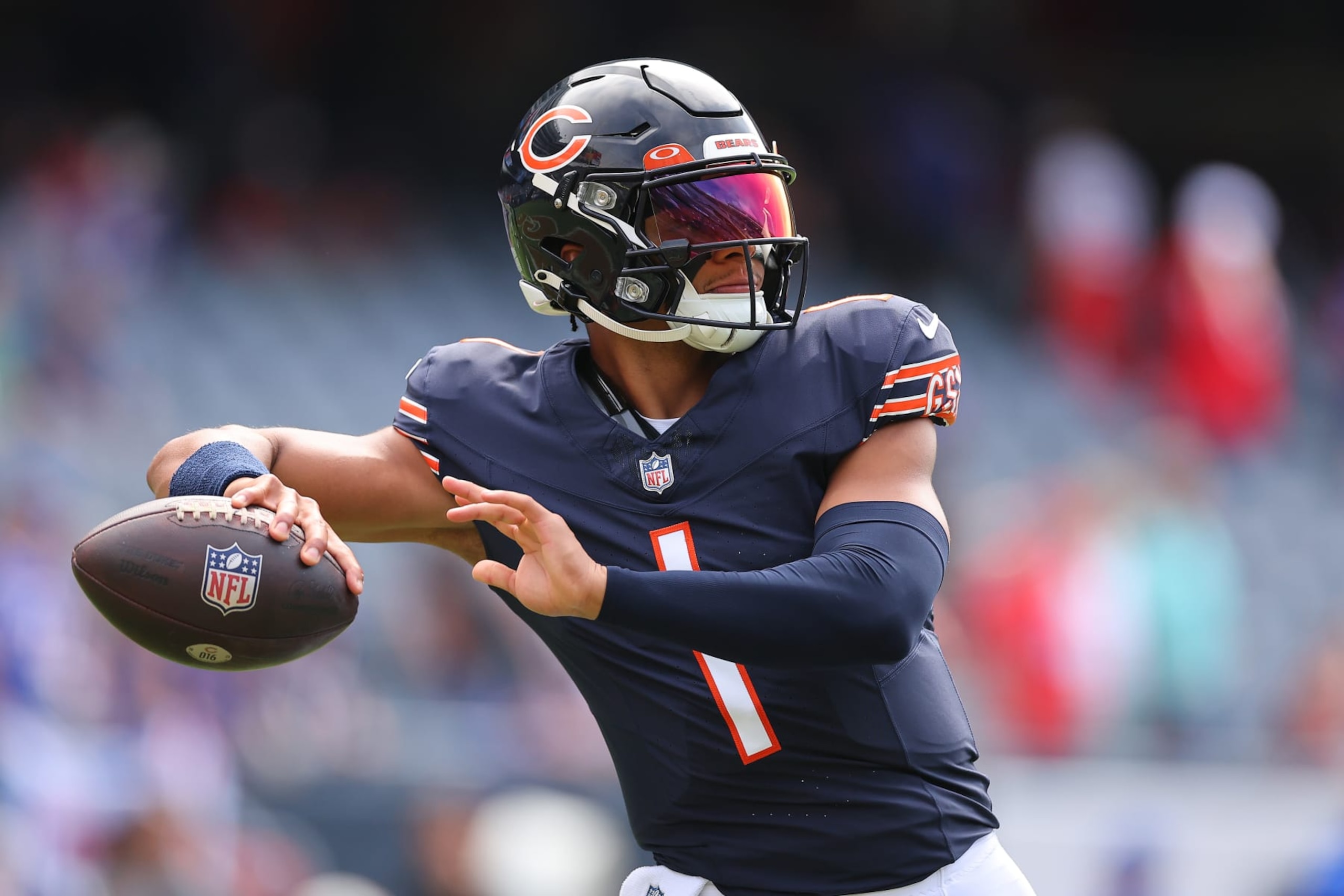 CHICAGO, ILLINOIS - AUGUST 26: Justin Fields #1 of the Chicago Bears warms up prior to a preseason game against the Buffalo Bills at Soldier Field on August 26, 2023 in Chicago, Illinois. (Photo by Michael Reaves/Getty Images)
