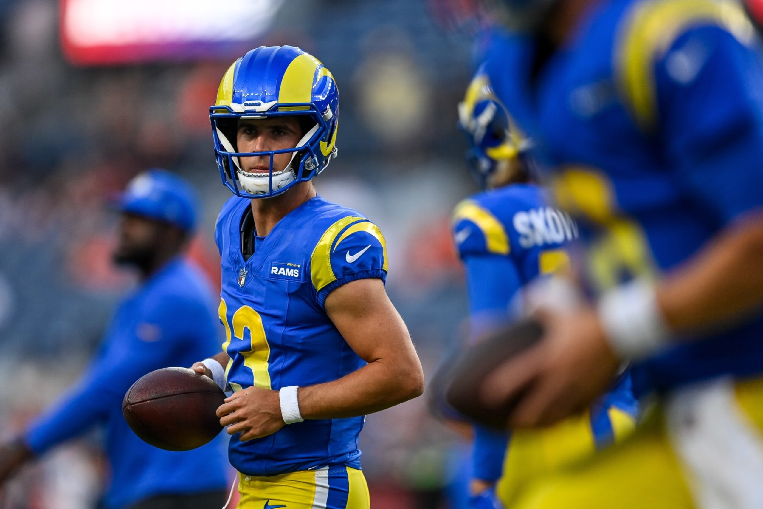DENVER, COLORADO - AUGUST 26:  Quarterback Stetson Bennett #13 of the Los Angeles Rams warms up before a preseason game against the Denver Broncos at Empower Field at Mile High on August 26, 2023 in Denver, Colorado. (Photo by Dustin Bradford/Getty Images)
