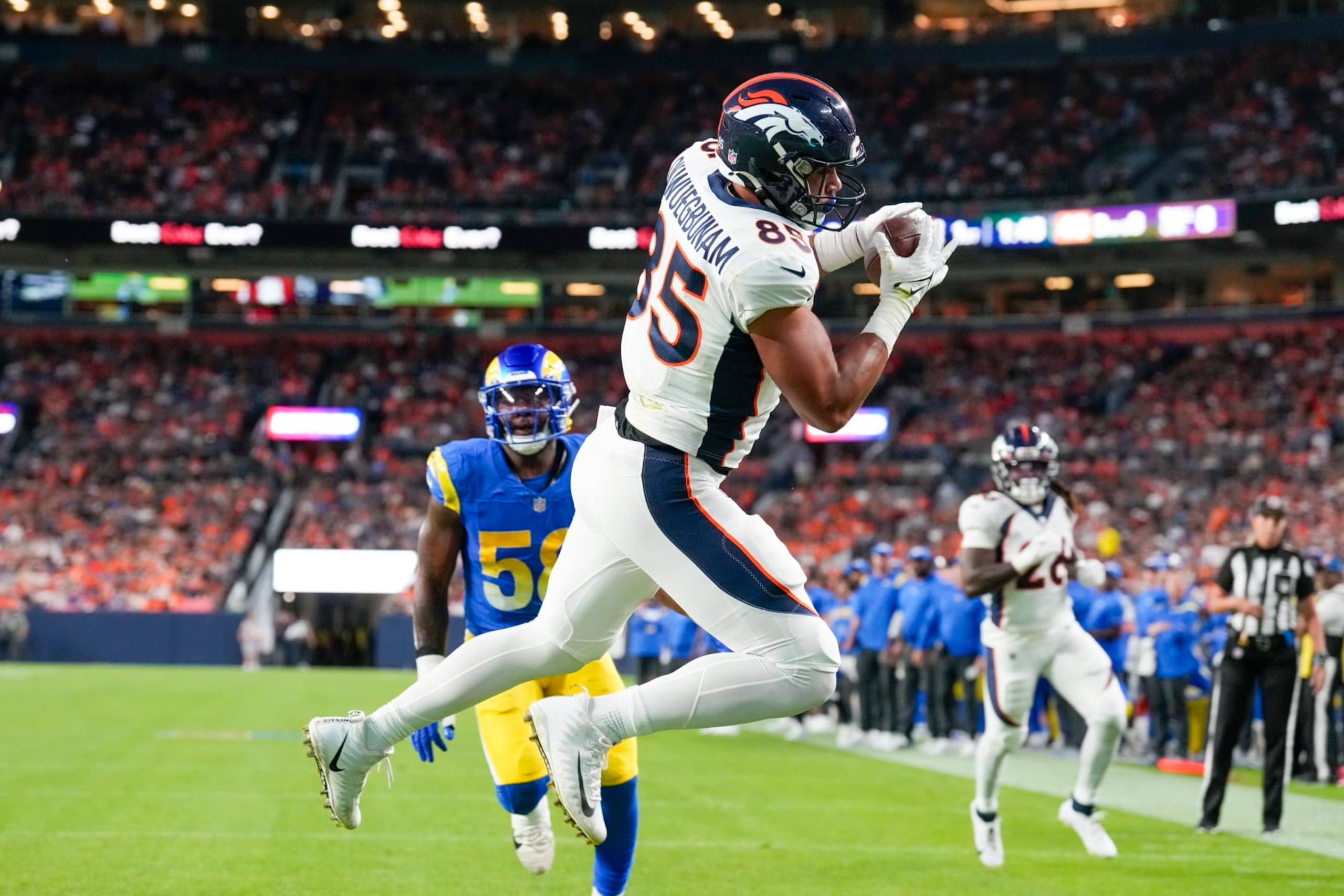 Denver Broncos tight end Albert Okwuegbunam catches a touchdown pass against the Los Angeles Ramsduring the first half of an NFL preseason football game Saturday, Aug. 26, 2023, in Denver. (AP Photo/David Zalubowski)