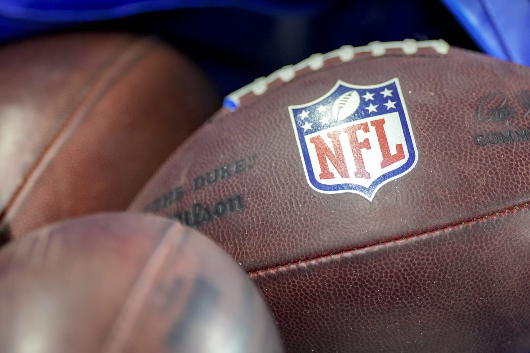 DETROIT, MICHIGAN - AUGUST 19: The NFL logo is pictured on a Wilson brand football during the preseason game between the Detroit Lions and Jacksonville Jaguars at Ford Field on August 19, 2023 in Detroit, Michigan. (Photo by Nic Antaya/Getty Images)